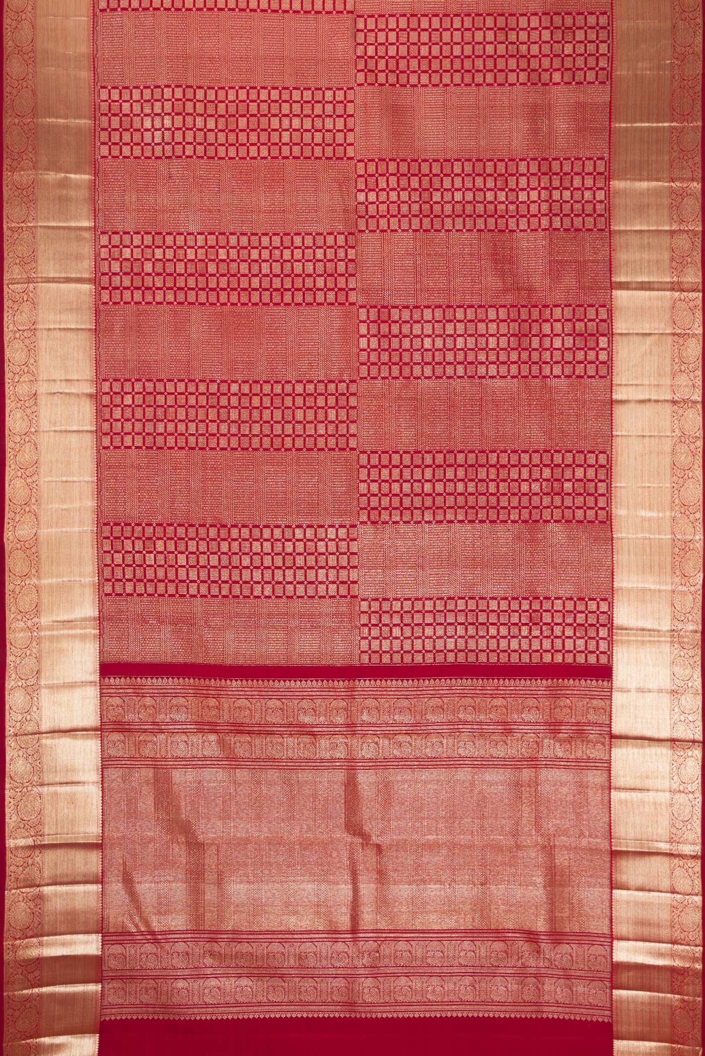 Flat view of Maroon Kanchipuram Silk Saree with Zari Brocade on the body and Zari Border. 