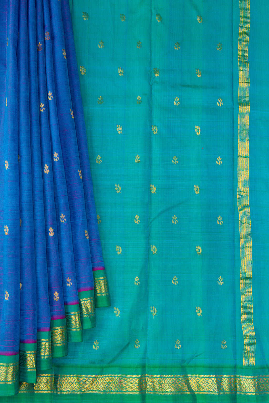 Pleats and pallu of Peacock Blue Dual Tone Kanjivaram Silk Saree with Zari Butta on the body and Zari Border. 