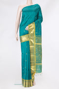 Peacock Blue Kanjivaram Silk Saree with Zari Butta on the body and One Side Border.  displayed on a mannequin