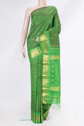 Green Kanjivaram Silk Saree with Zari Butta on the body and One Side Border.  displayed on a mannequin