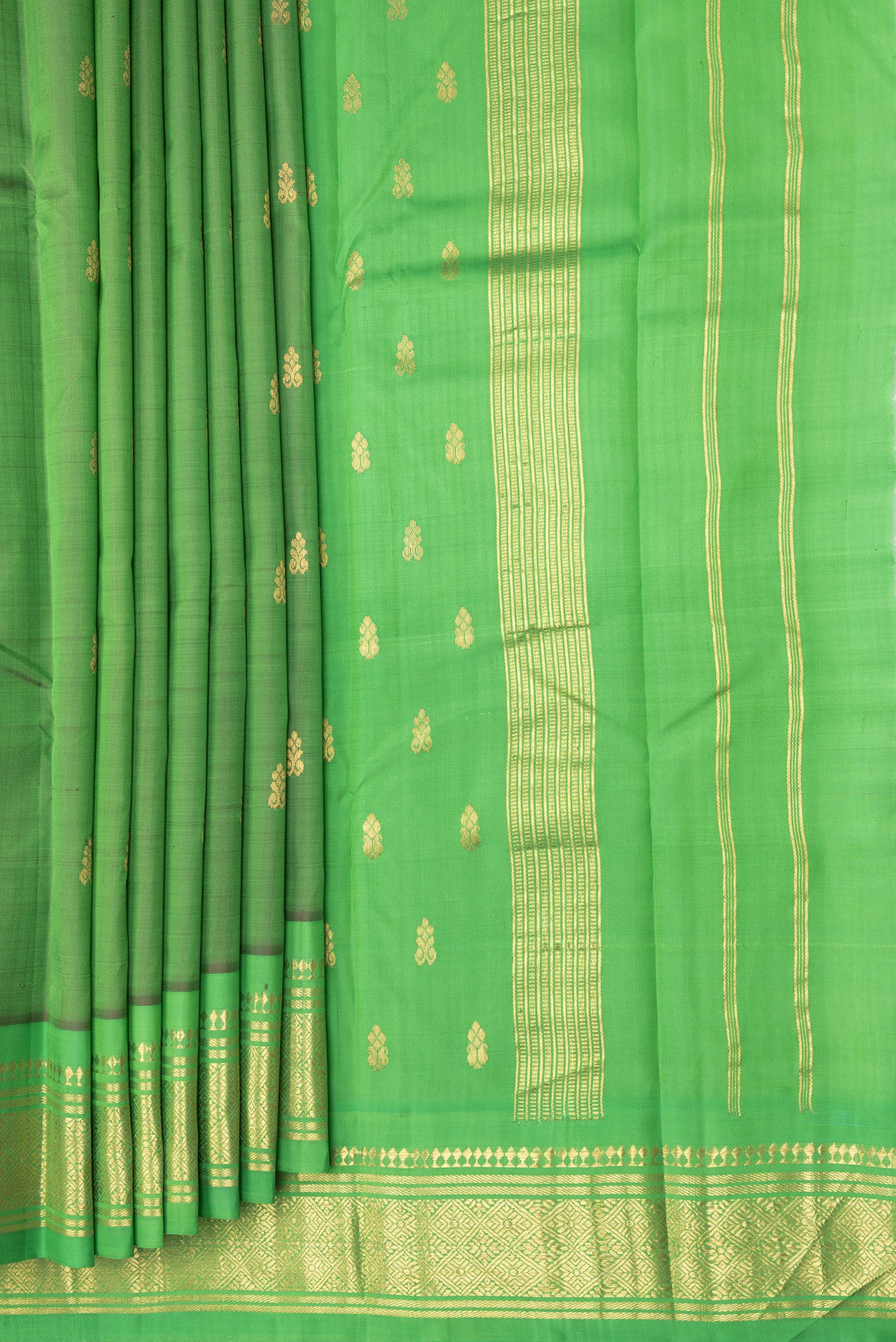 Pleats and pallu of Green Kanjivaram Silk Saree with Zari Butta on the body and One Side Border. 