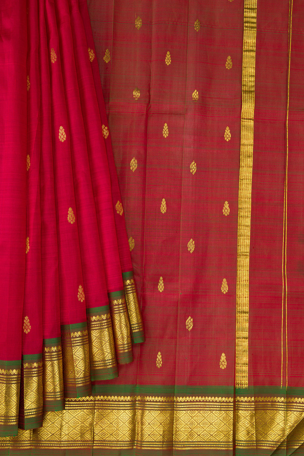 Pleats and pallu of Maroon Kanjivaram Silk Saree with Zari Butta on the body and One Side Border. 