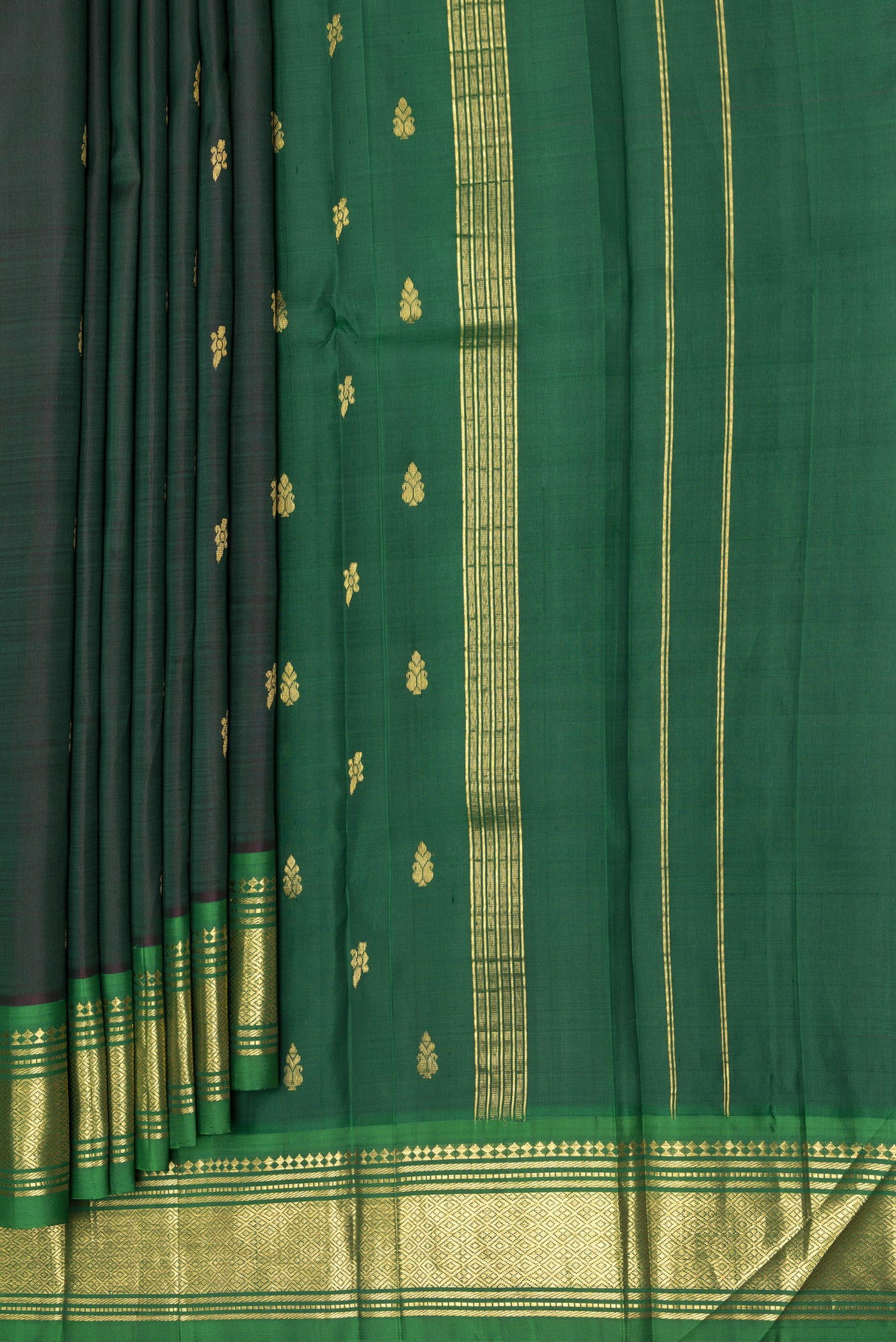 Pleats and pallu of Bottle Green Kanjivaram Silk Saree with Zari Butta on the body and One Side Border. 
