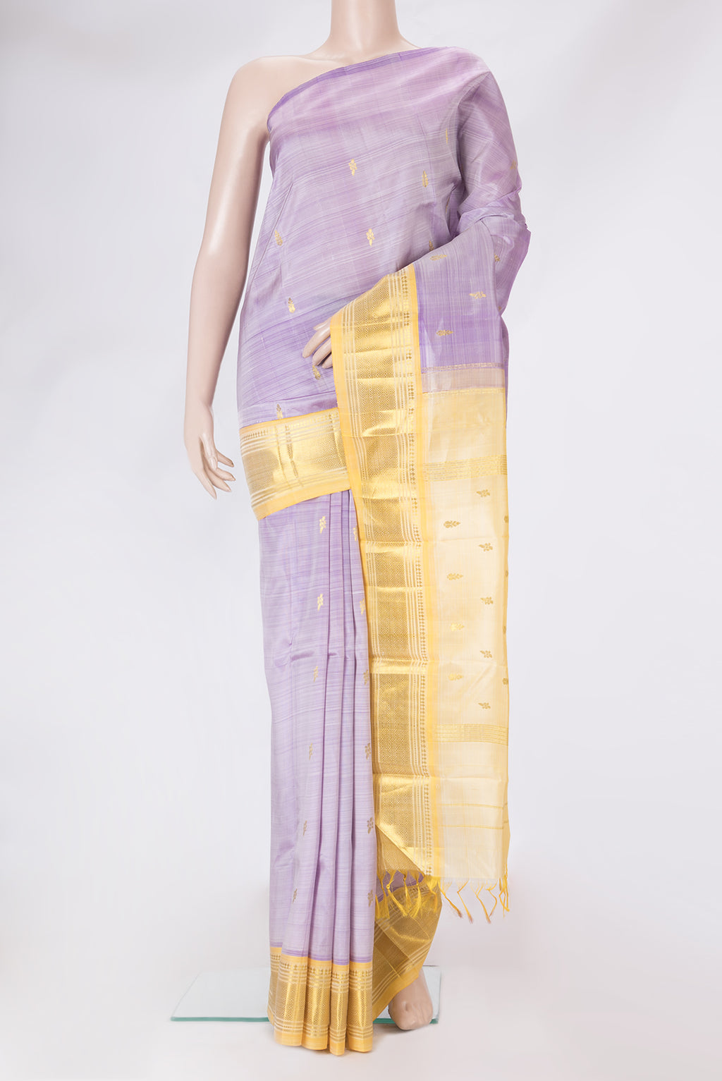 Lavender Kanjivaram Silk Saree with Zari Butta on the body and One Side Border.  displayed on a mannequin