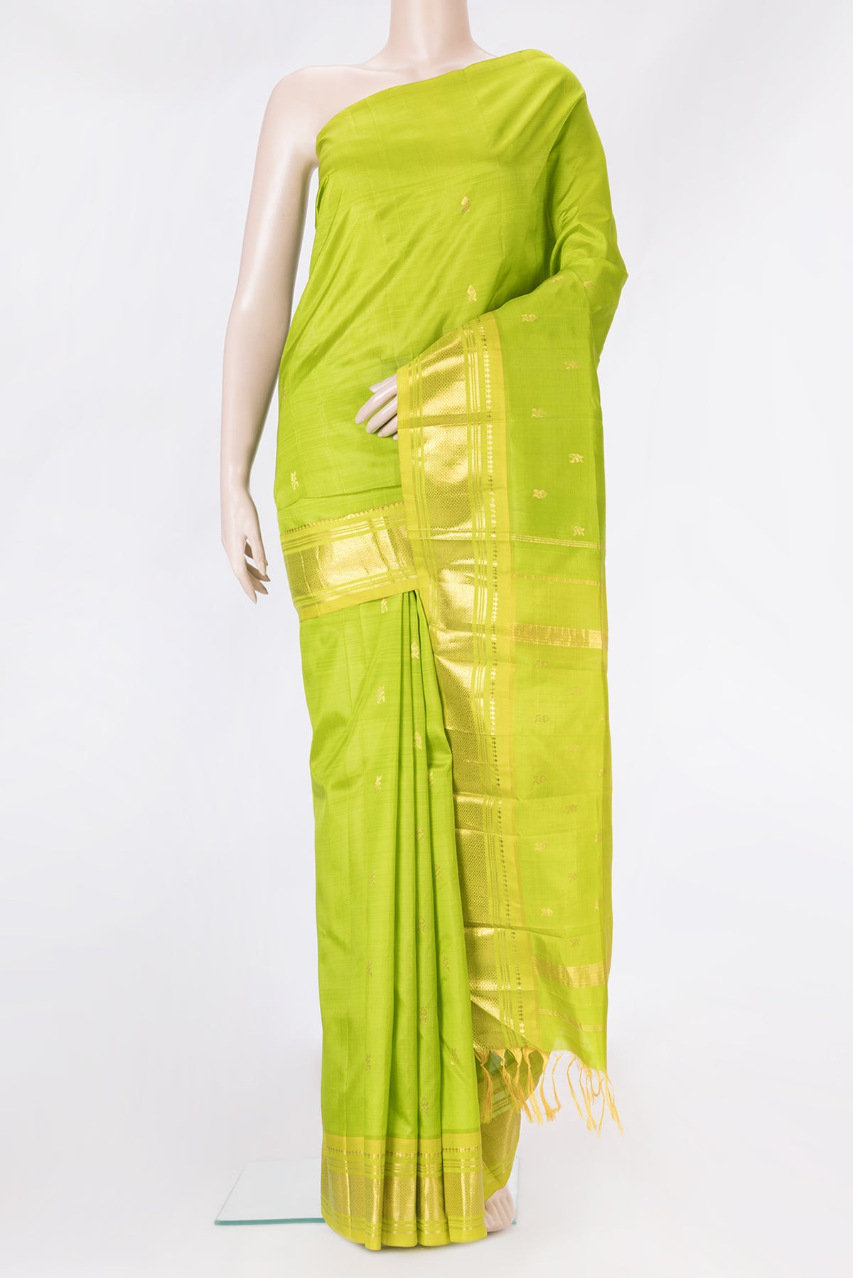 Parrot Green Kanjivaram Silk Saree with Zari Butta on the body and One Side Border.  displayed on a mannequin