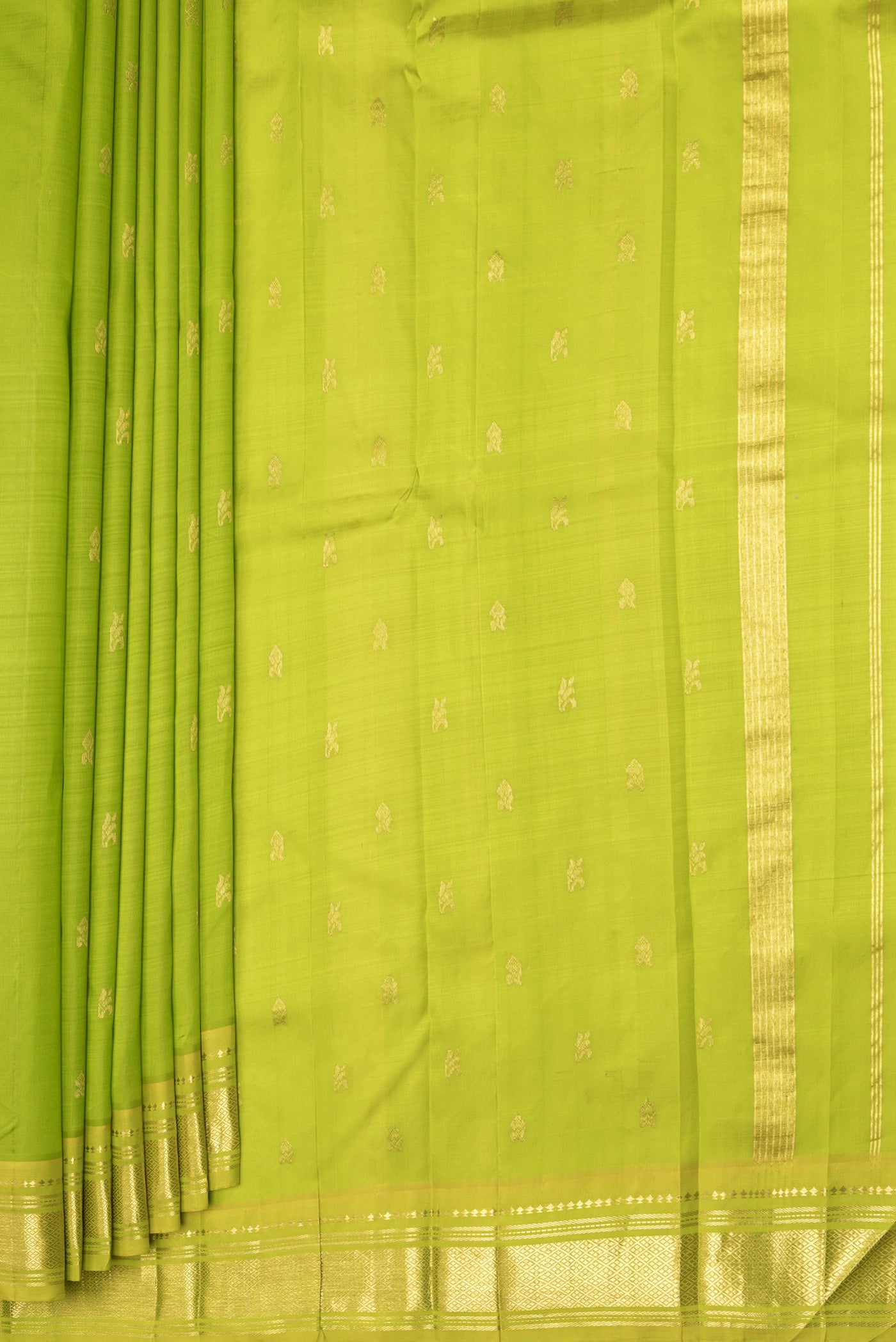 Pleats and pallu of Parrot Green Kanjivaram Silk Saree with Zari Butta on the body and One Side Border. 