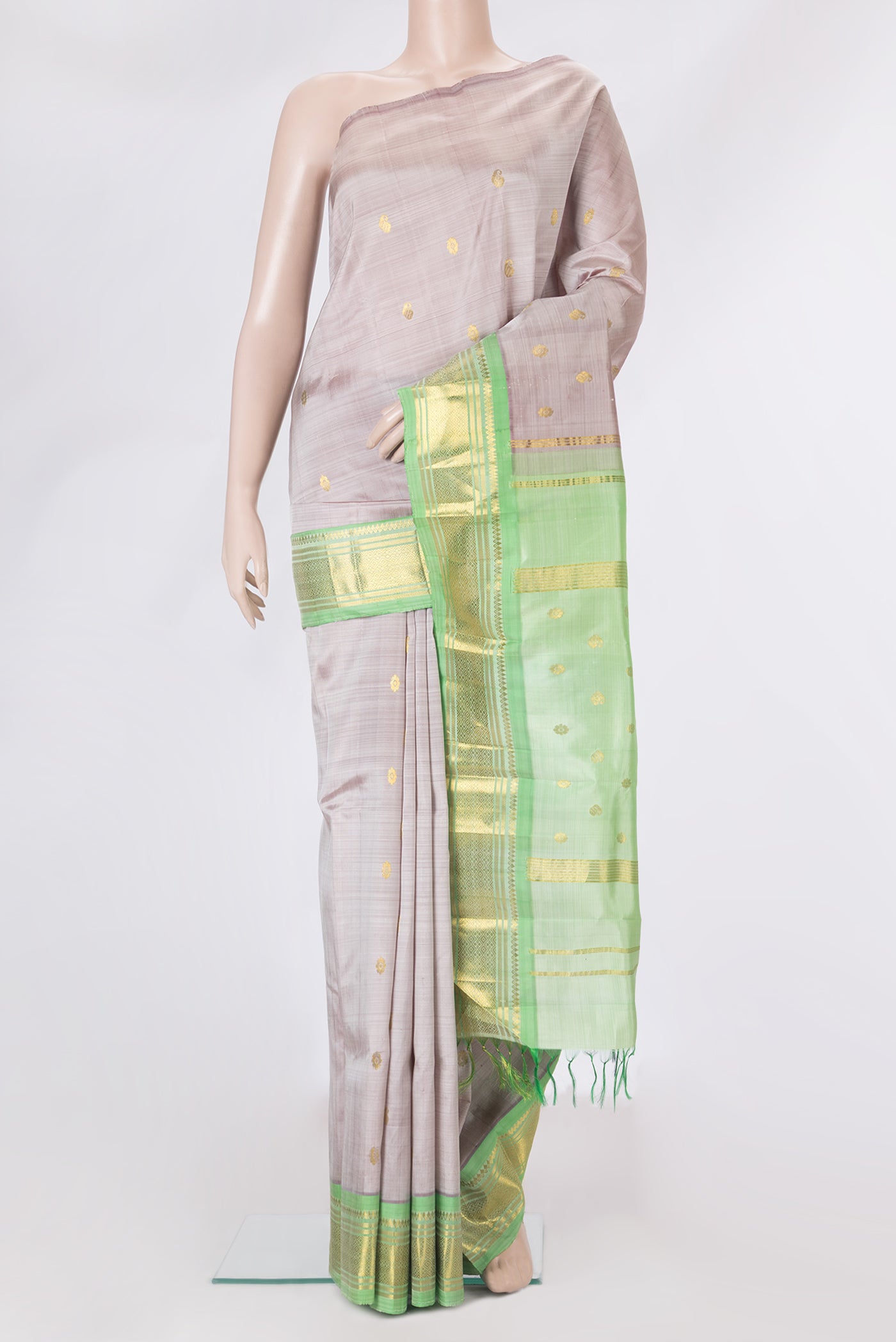 Rose Gold Dual Tone Kanjivaram Silk Saree with Zari Butta on the body and One Side Border.  displayed on a mannequin