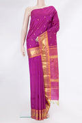 Magenta Kanjivaram Silk Saree with Zari Butta on the body and One Side Border.  displayed on a mannequin
