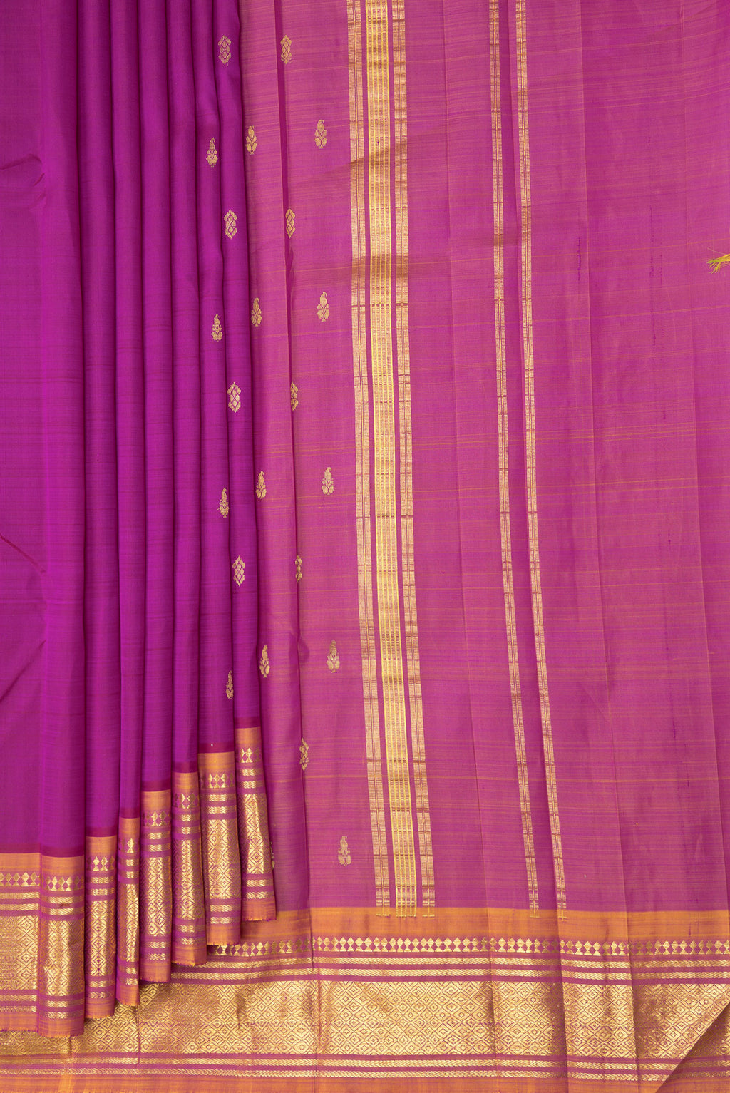Pleats and pallu of Magenta Kanjivaram Silk Saree with Zari Butta on the body and One Side Border. 
