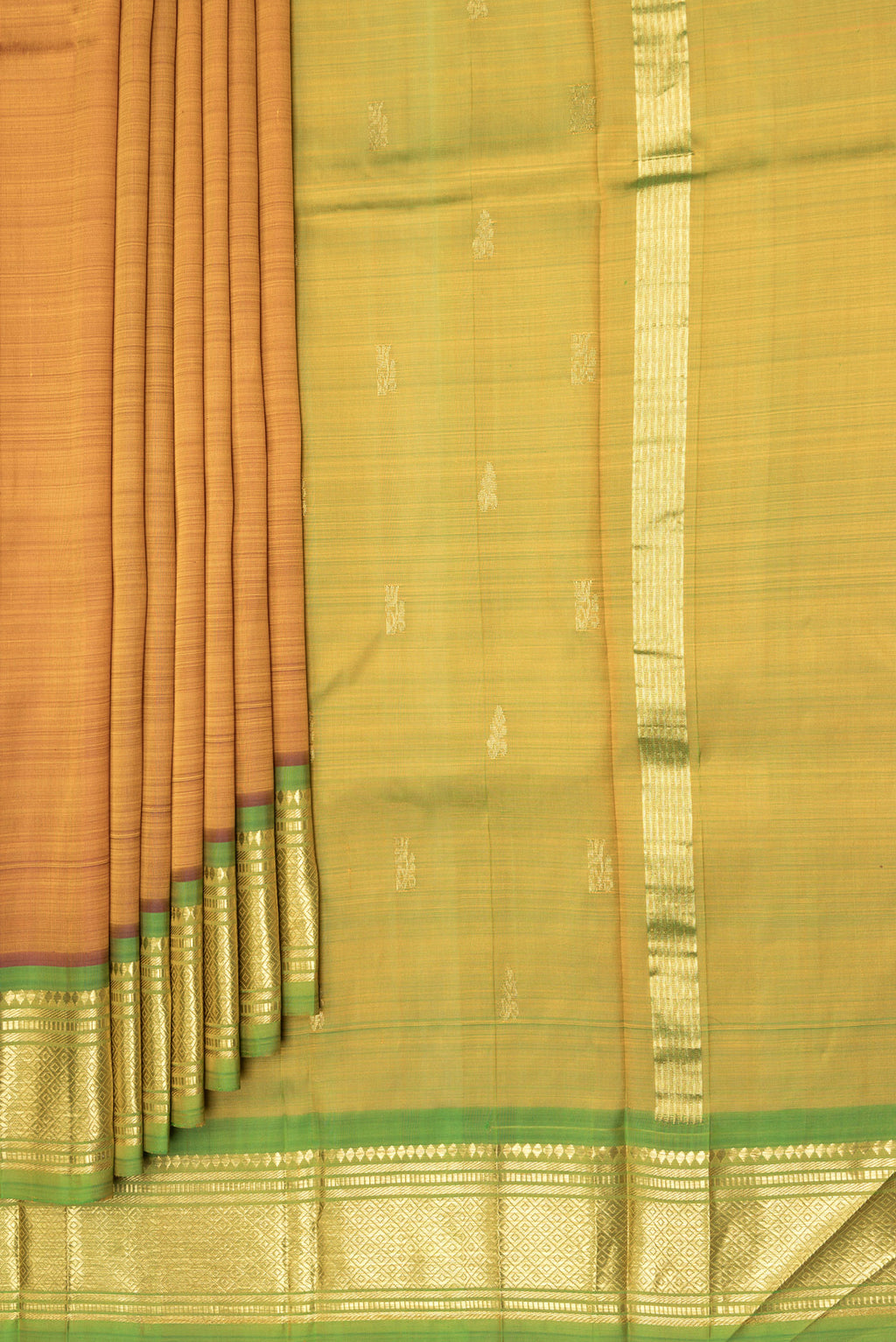 Pleats and pallu of Gold Dual Tone Kanjivaram Silk Saree with Zari Butta on the body and One Side Border. 
