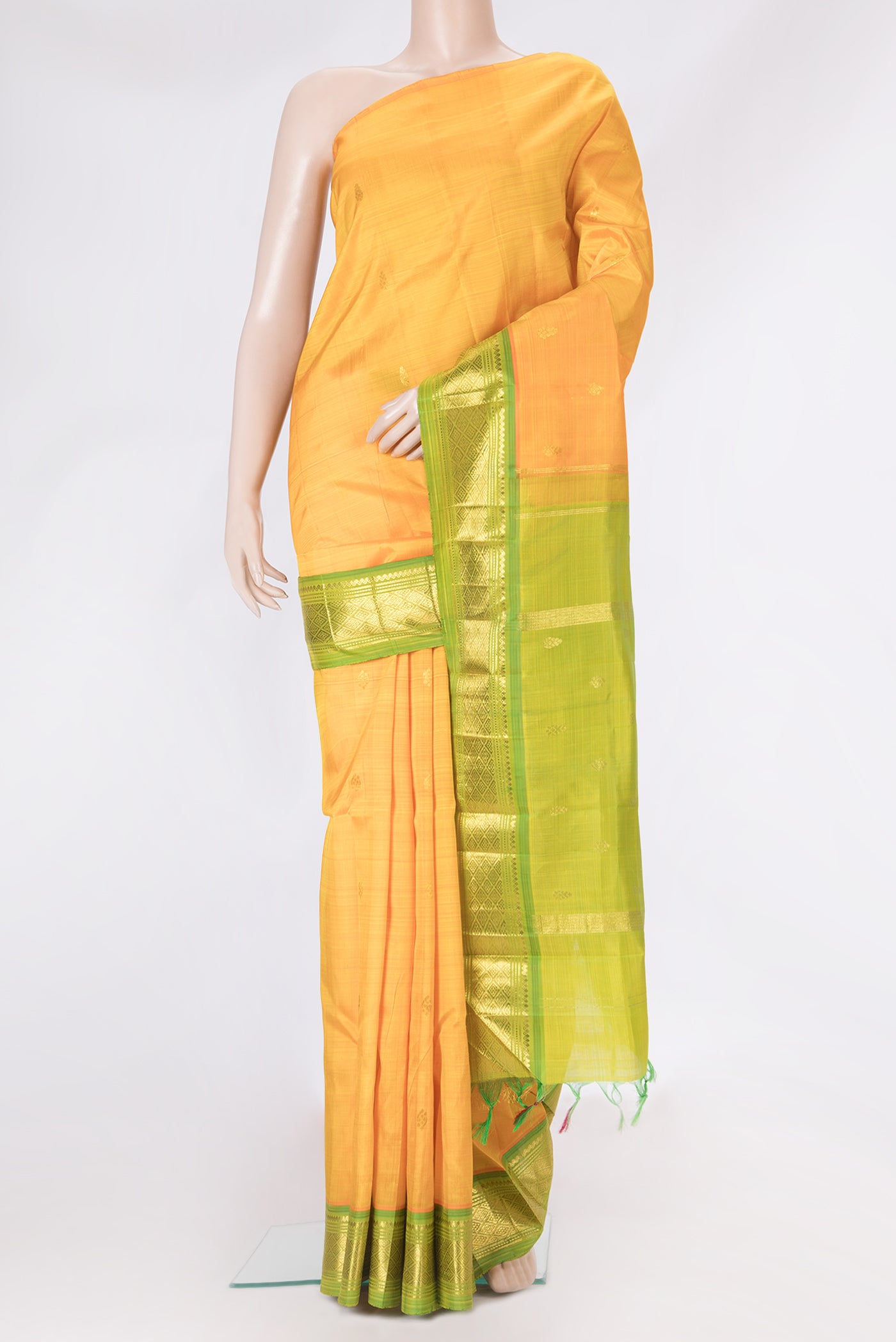 Yellow Dual Tone Kanjivaram Silk Saree with Zari Butta on the body and Zari Border.  displayed on a mannequin