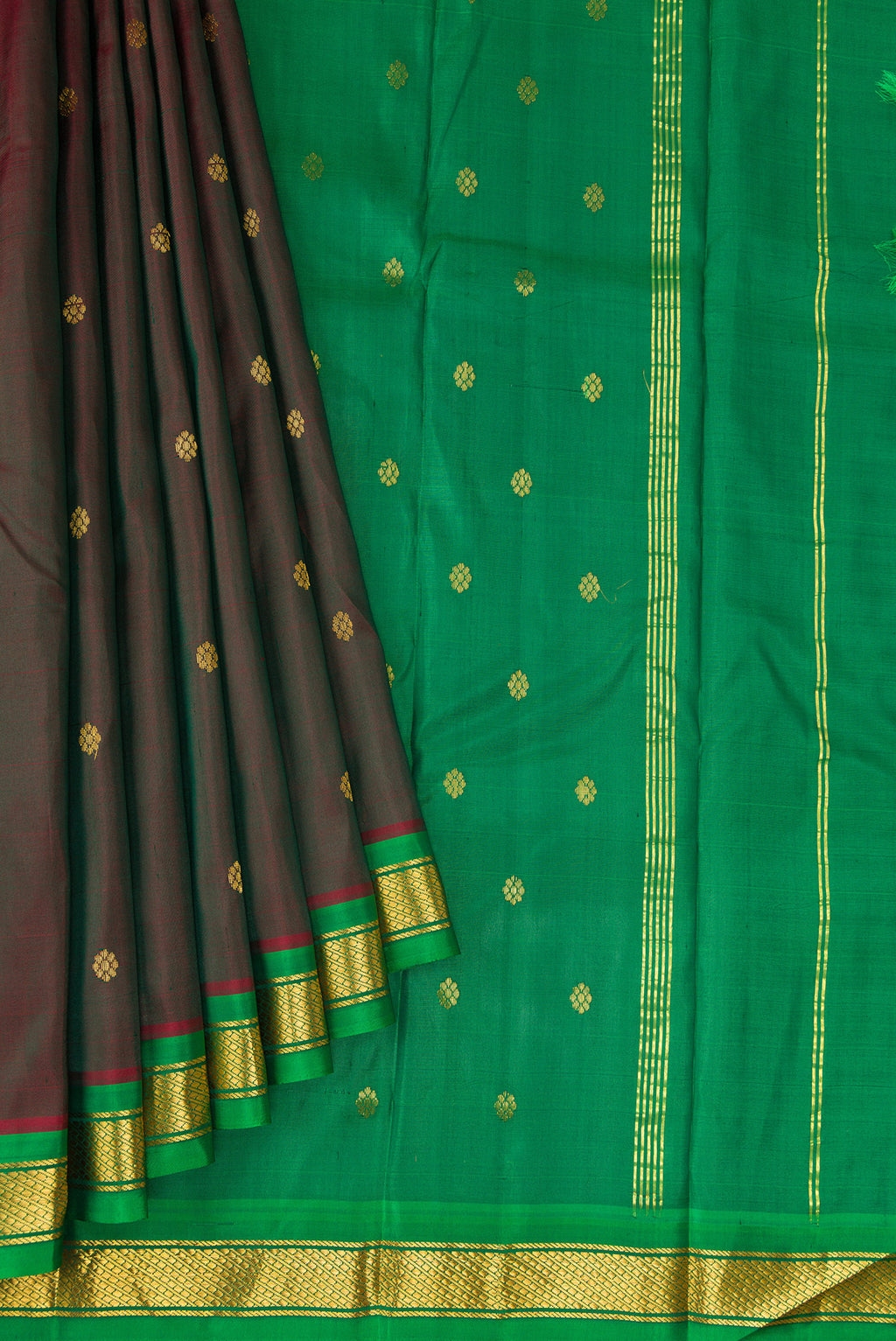 Pleats and pallu of Maroon Dual Tone Kanchipuram Silk Saree with Zari Butta on the body and Zari Border. 