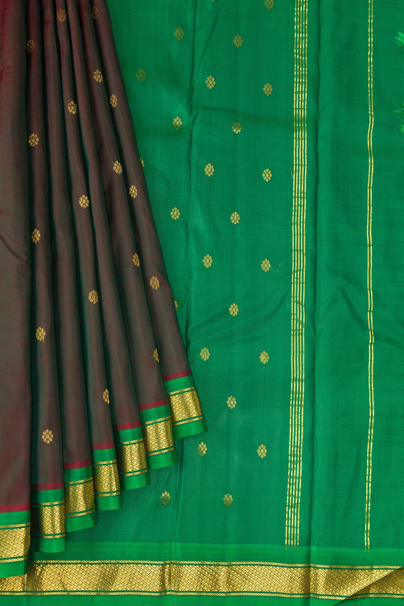 Pleats and pallu of Maroon Dual Tone Kanchipuram Silk Saree with Zari Butta on the body and Zari Border. 