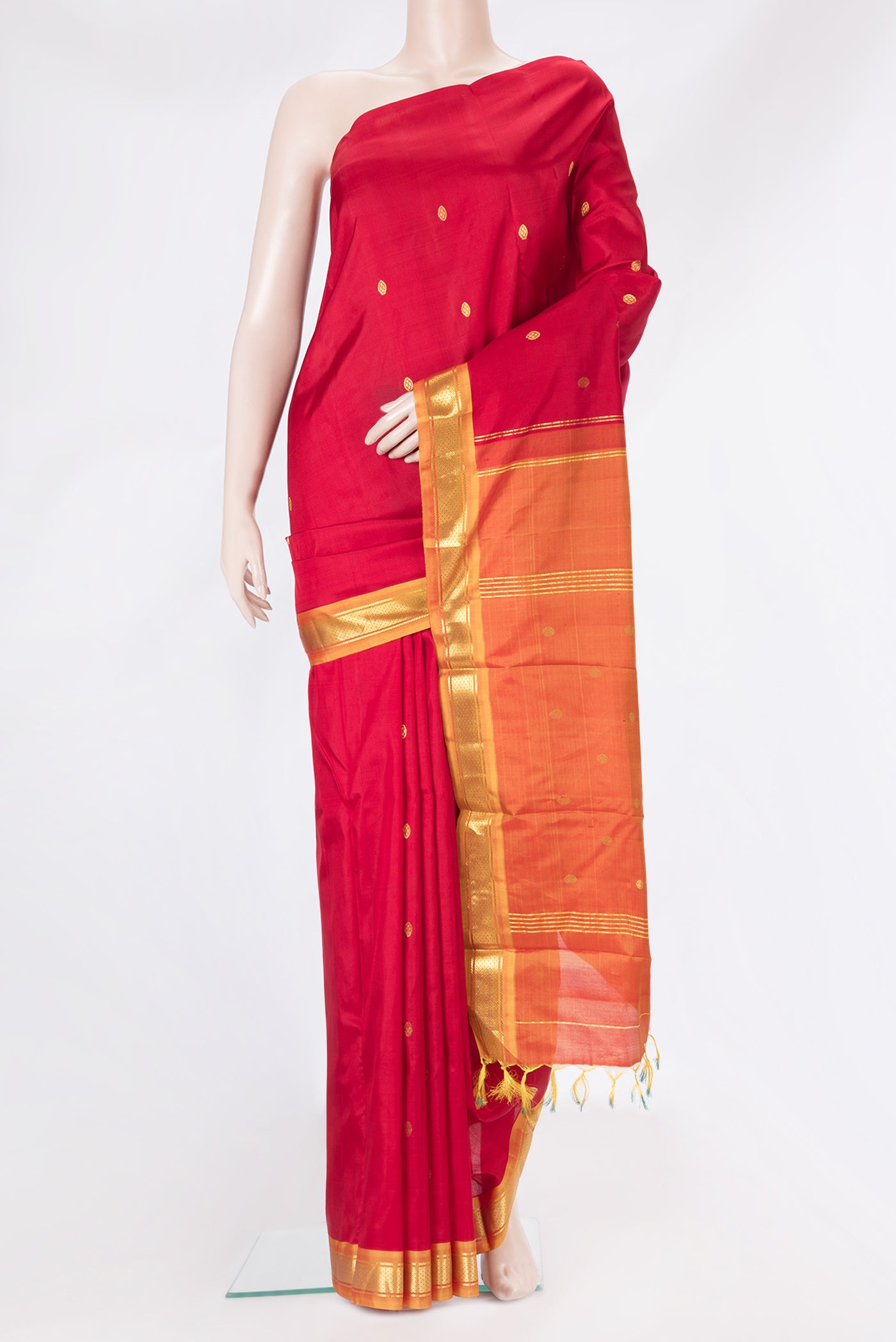 Red Kanchipuram Silk Saree with Zari Butta on the body and Zari Border.  displayed on a mannequin