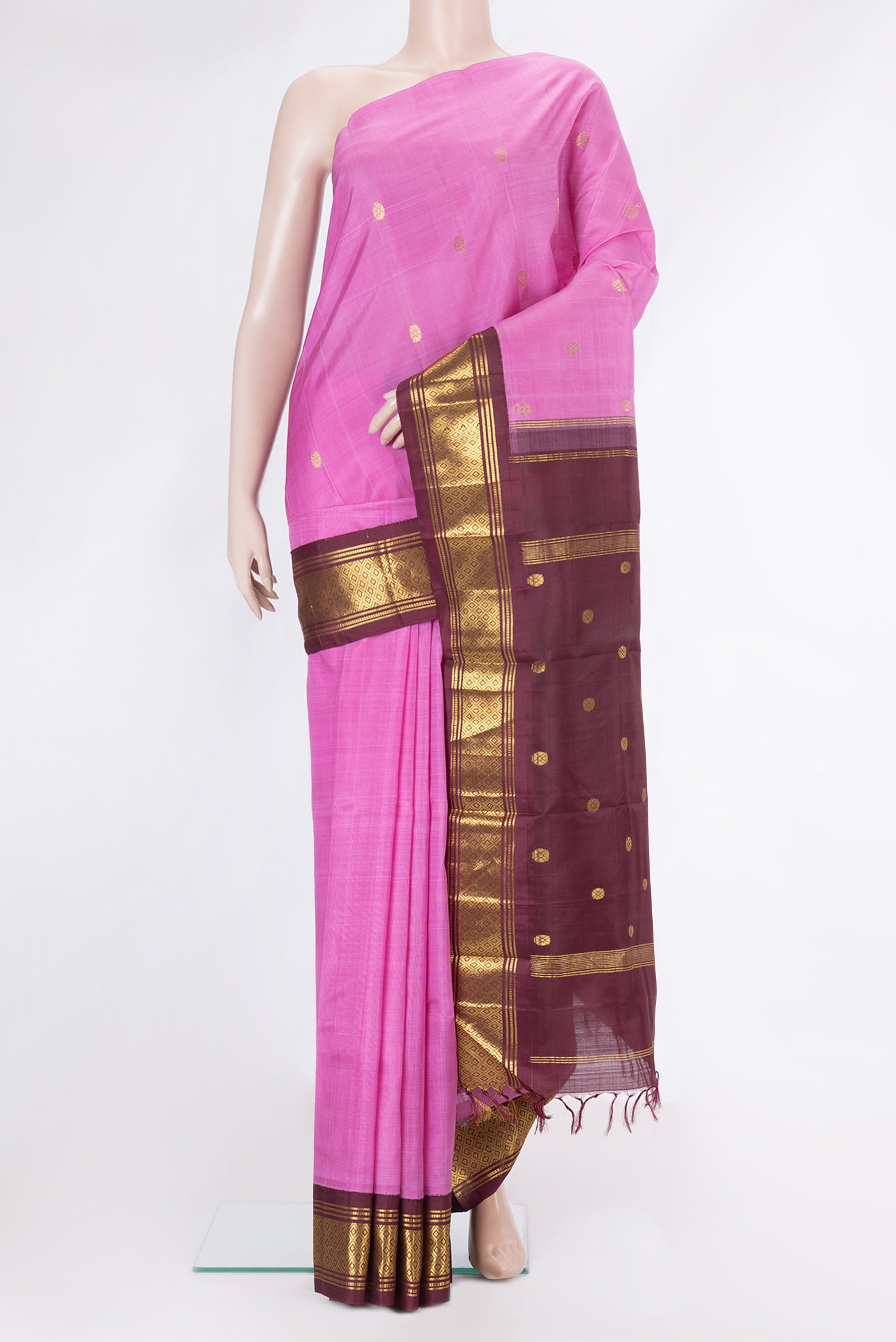 Pink Kanchipuram Silk Saree with Zari Butta on the body and One Side Border.  displayed on a mannequin