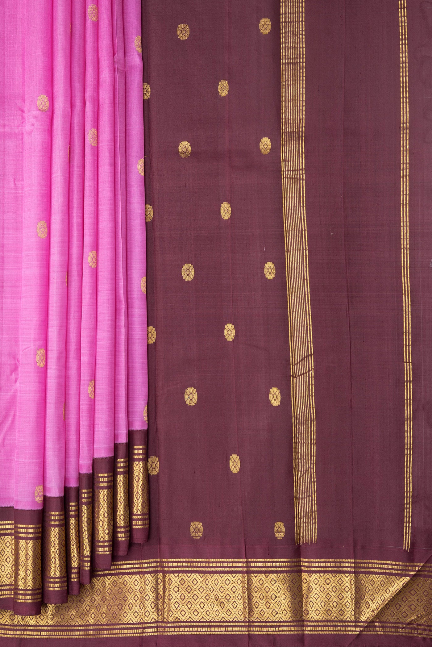 Pleats and pallu of Pink Kanchipuram Silk Saree with Zari Butta on the body and One Side Border. 