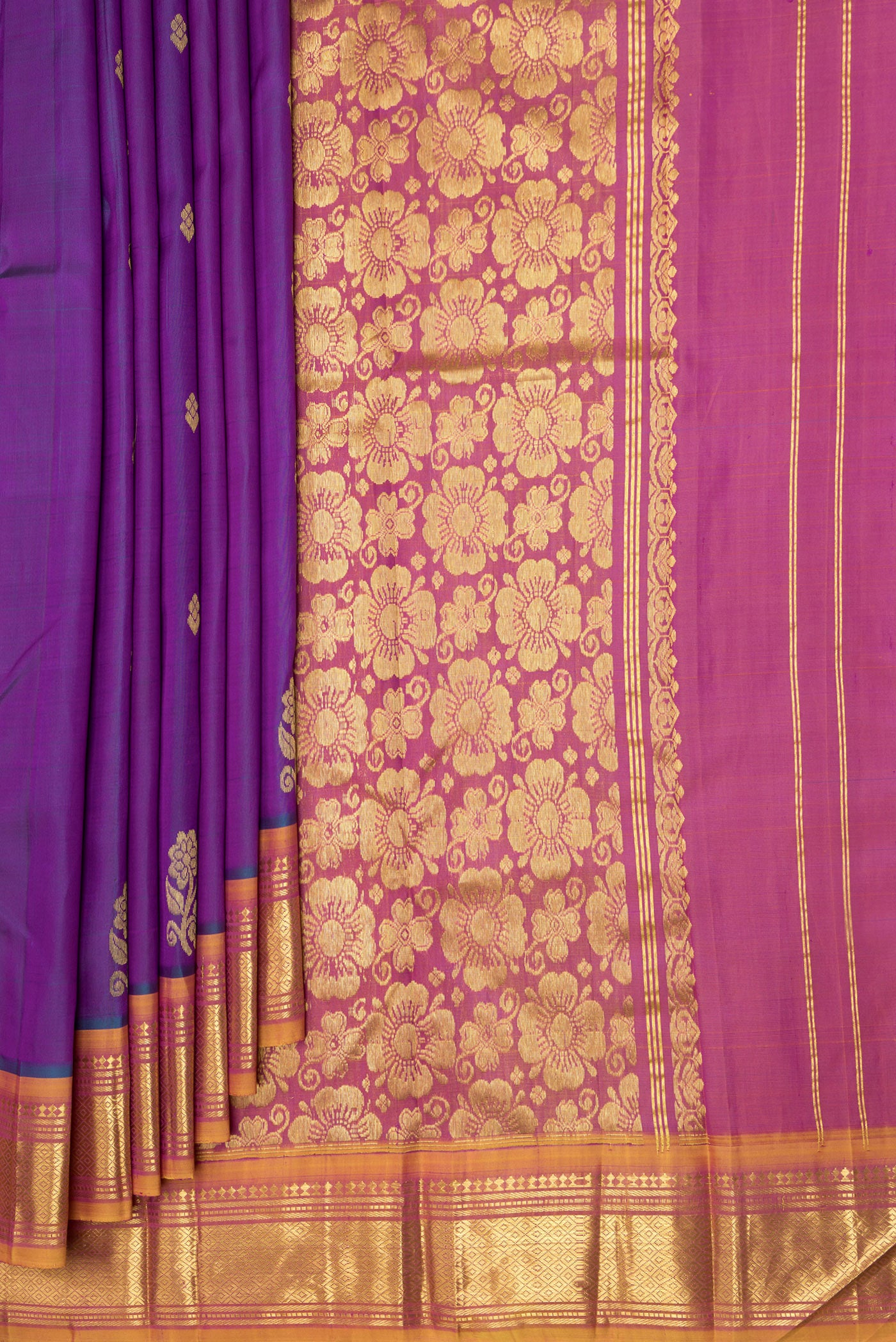 Pleats and pallu of Purple Dual Tone Kanjivaram Silk Saree with Zari Butta on the body and One Side Border. 