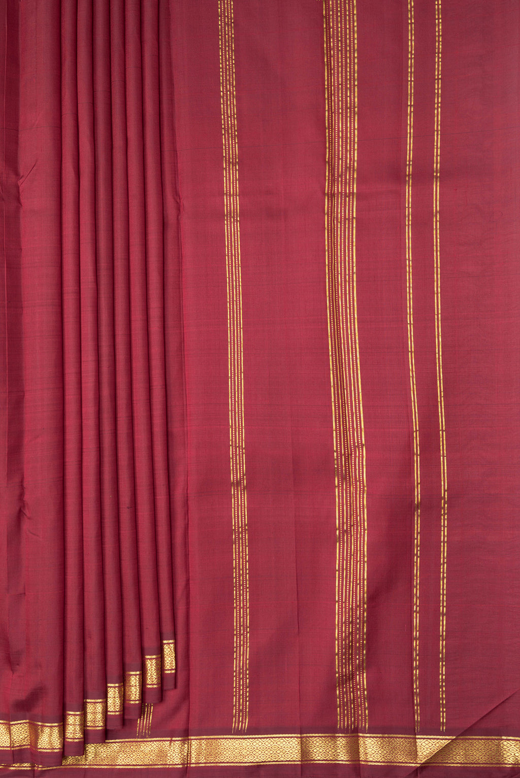 Pleats and pallu of Maroon Kanjivaram Silk Saree with Plain Body and Zari Border. 