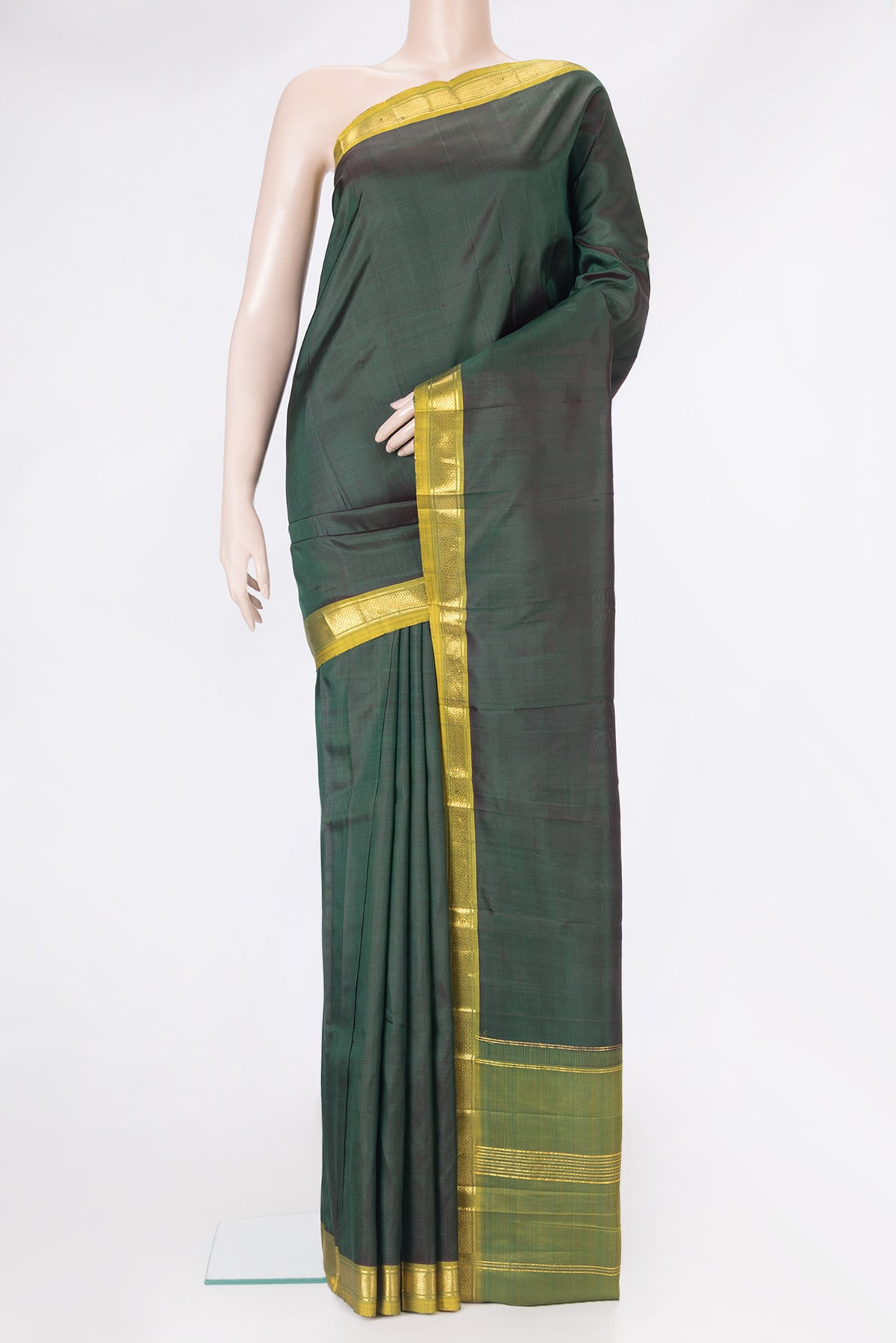 Bottle Green Dual Tone Kanjivaram Silk Saree with Plain Body and Zari Border.  displayed on a mannequin