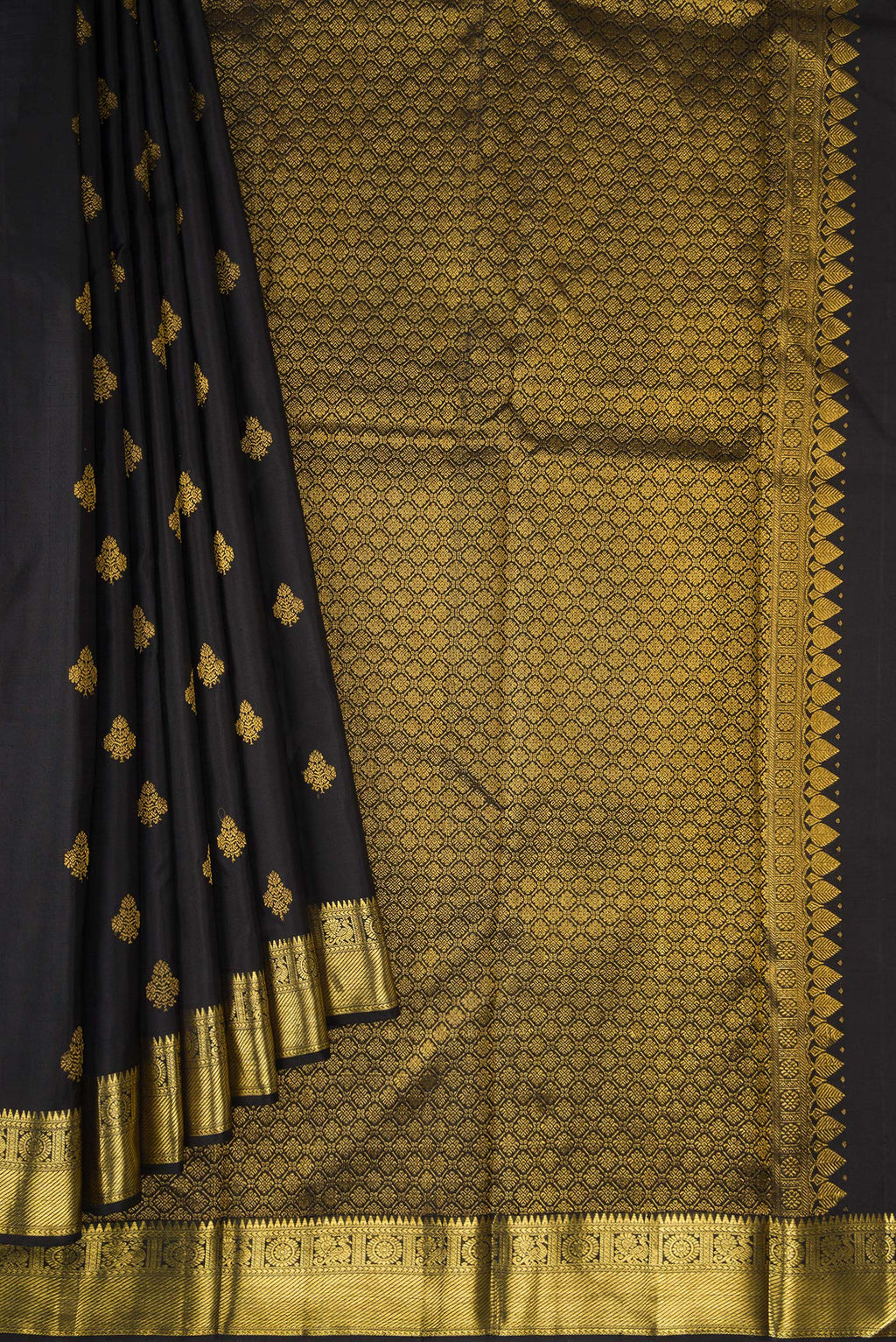 Pleats and pallu of Black Kanjivaram Silk Saree with Zari Butta on the body and Zari Border. 