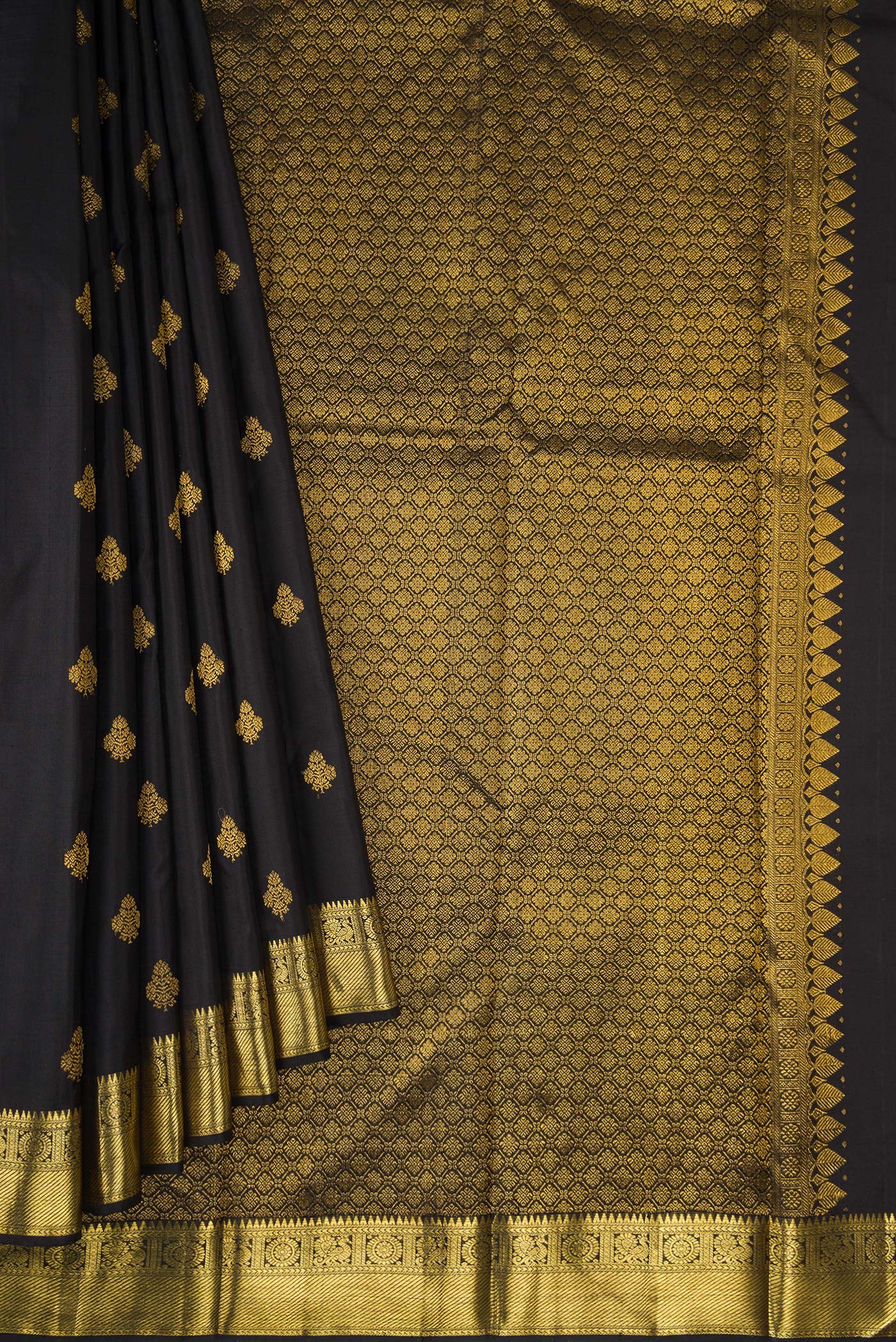Pleats and pallu of Black Kanjivaram Silk Saree with Zari Butta on the body and Zari Border. 