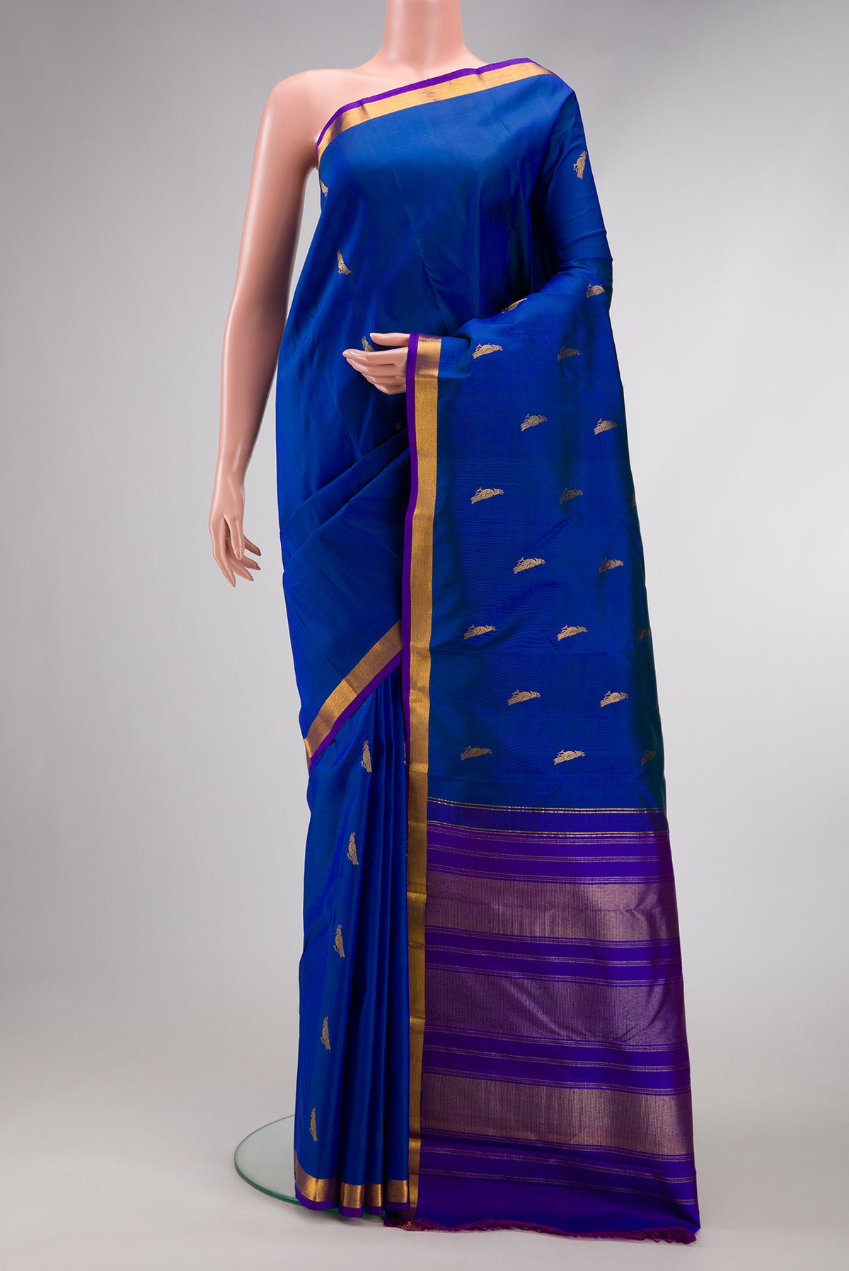 Royal Blue Dual Tone Kanchipuram Silk Saree with Zari Butta on the body and Zari Border.  displayed on a mannequin