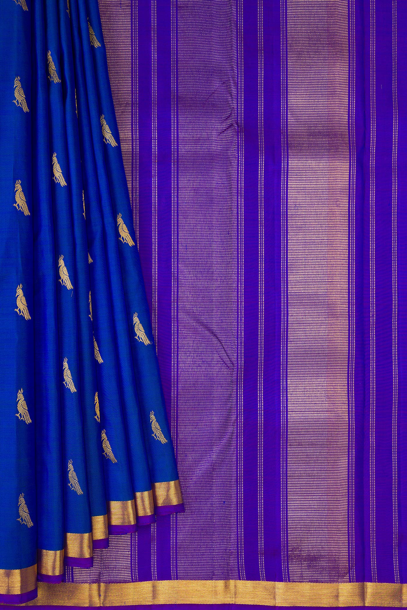 Pleats and pallu of Royal Blue Dual Tone Kanchipuram Silk Saree with Zari Butta on the body and Zari Border. 