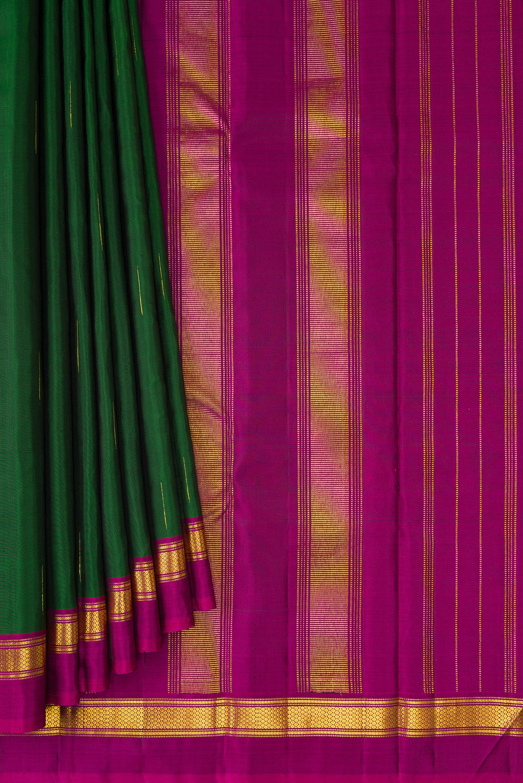 Pleats and pallu of Bottle Green Kanchipuram Silk Saree with Zari Butta on the body and Zari Border. 