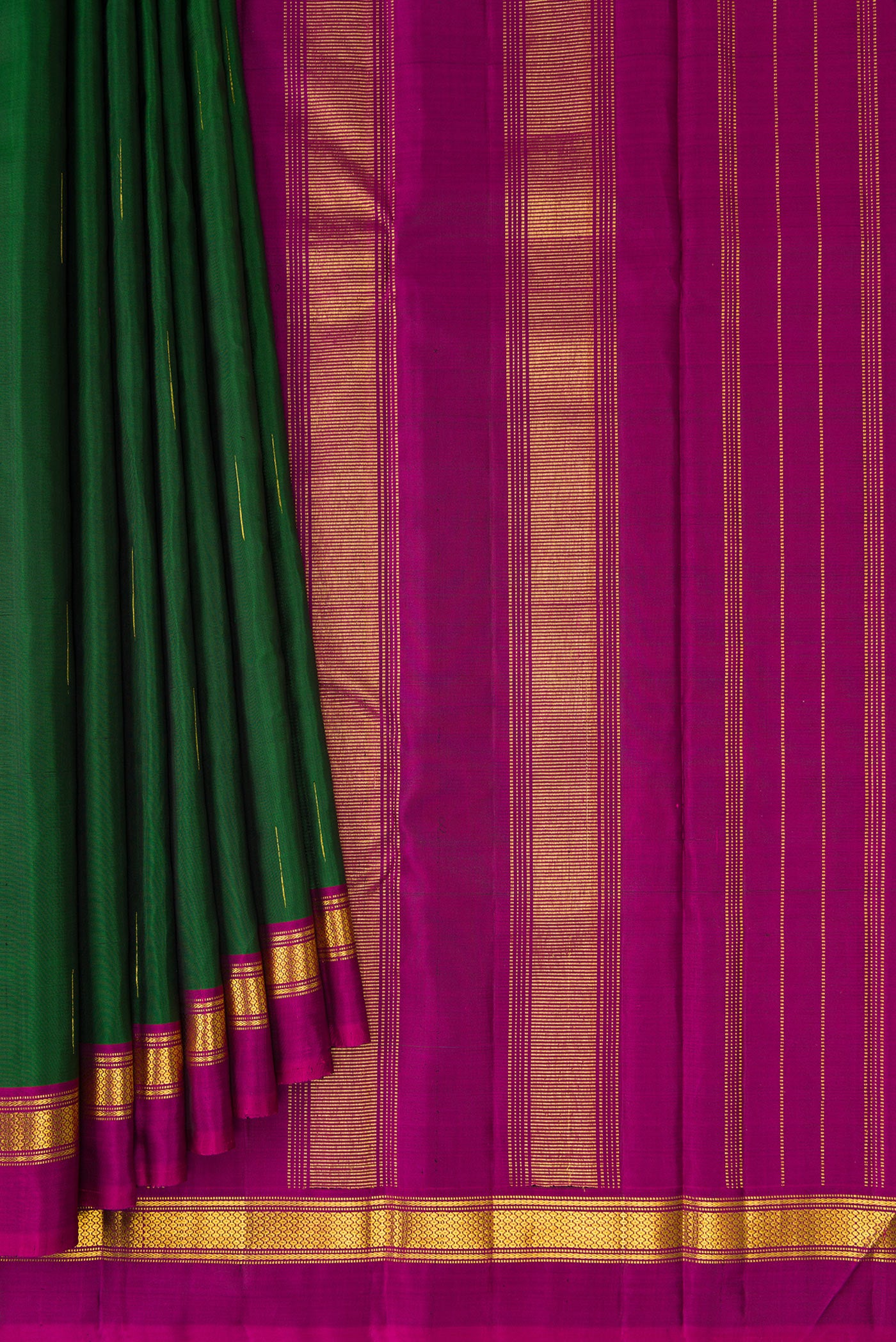 Pleats and pallu of Bottle Green Kanchipuram Silk Saree with Zari Butta on the body and Zari Border. 