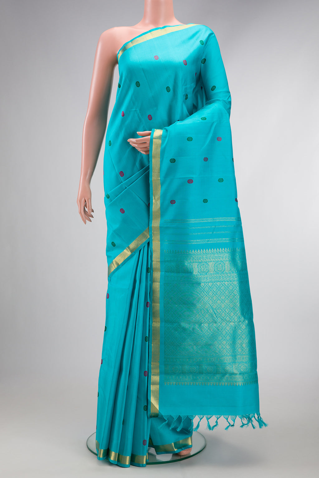 Sky Blue Dual Tone Kanchipuram Silk Saree with Thread Butta on the body and Zari Border.  displayed on a mannequin