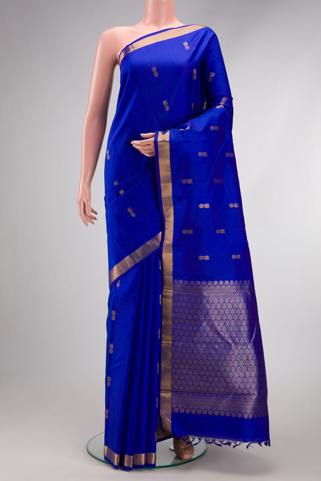 Royal Blue Dual Tone Kanchipuram Silk Saree with Zari Butta on the body and Zari Border.  displayed on a mannequin