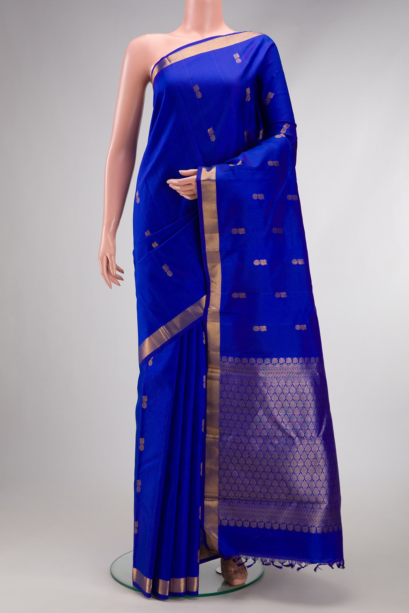 Royal Blue Dual Tone Kanchipuram Silk Saree with Zari Butta on the body and Zari Border.  displayed on a mannequin