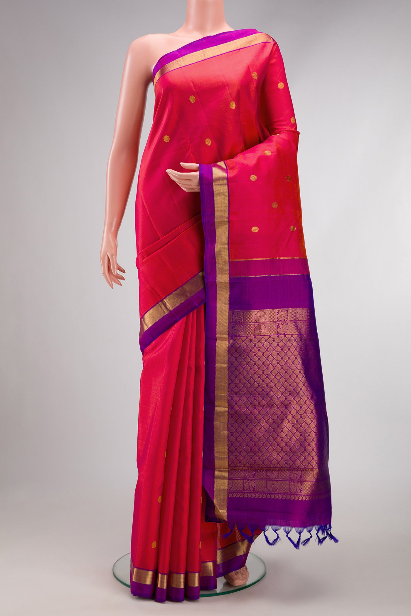 Coral Dual Tone Kanchipuram Silk Saree with Zari Butta on the body and Zari Border.  displayed on a mannequin