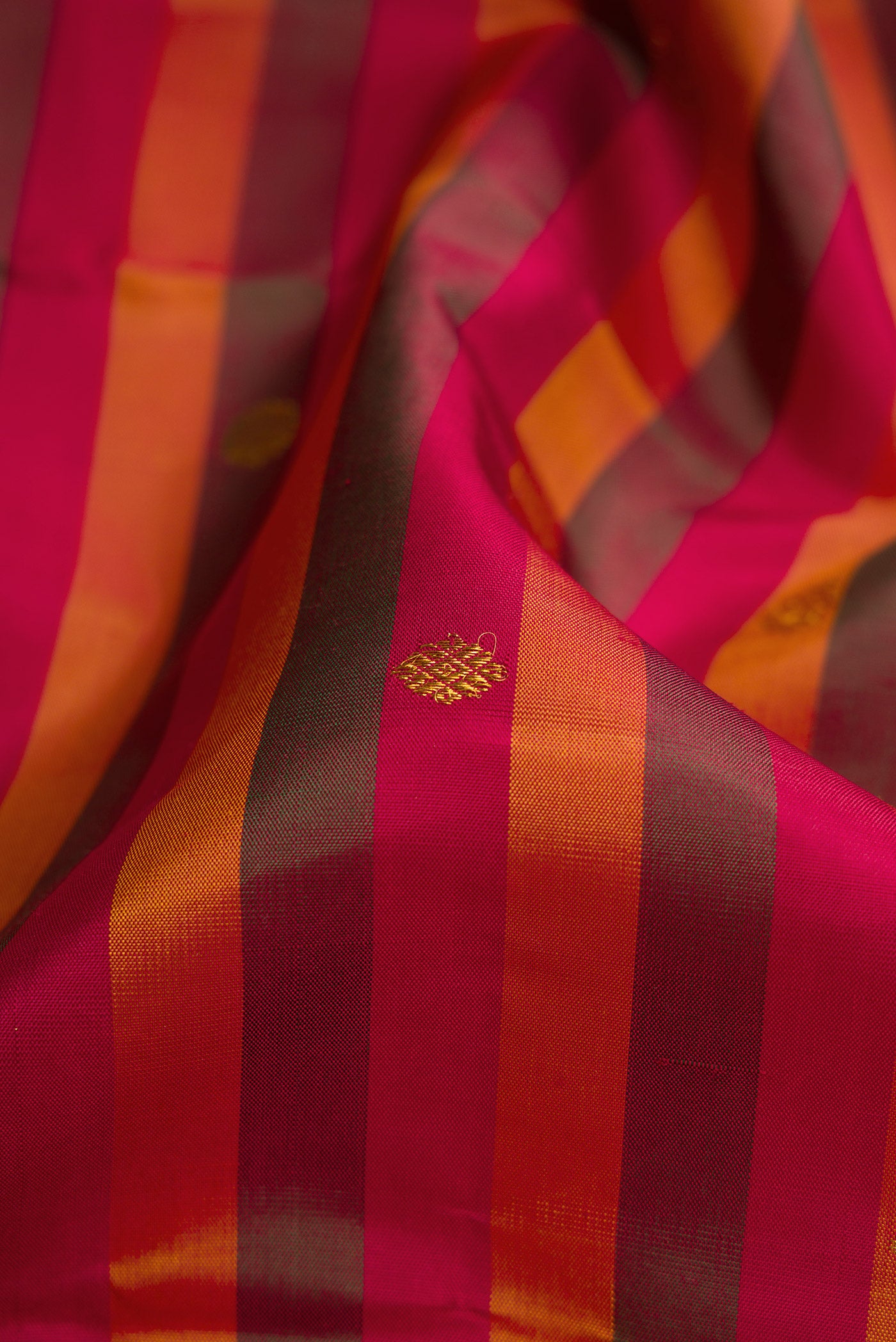 Close up of Multi Color Kanchipuram Silk Saree with Stripes on the body and Fancy Border.  displaying folds