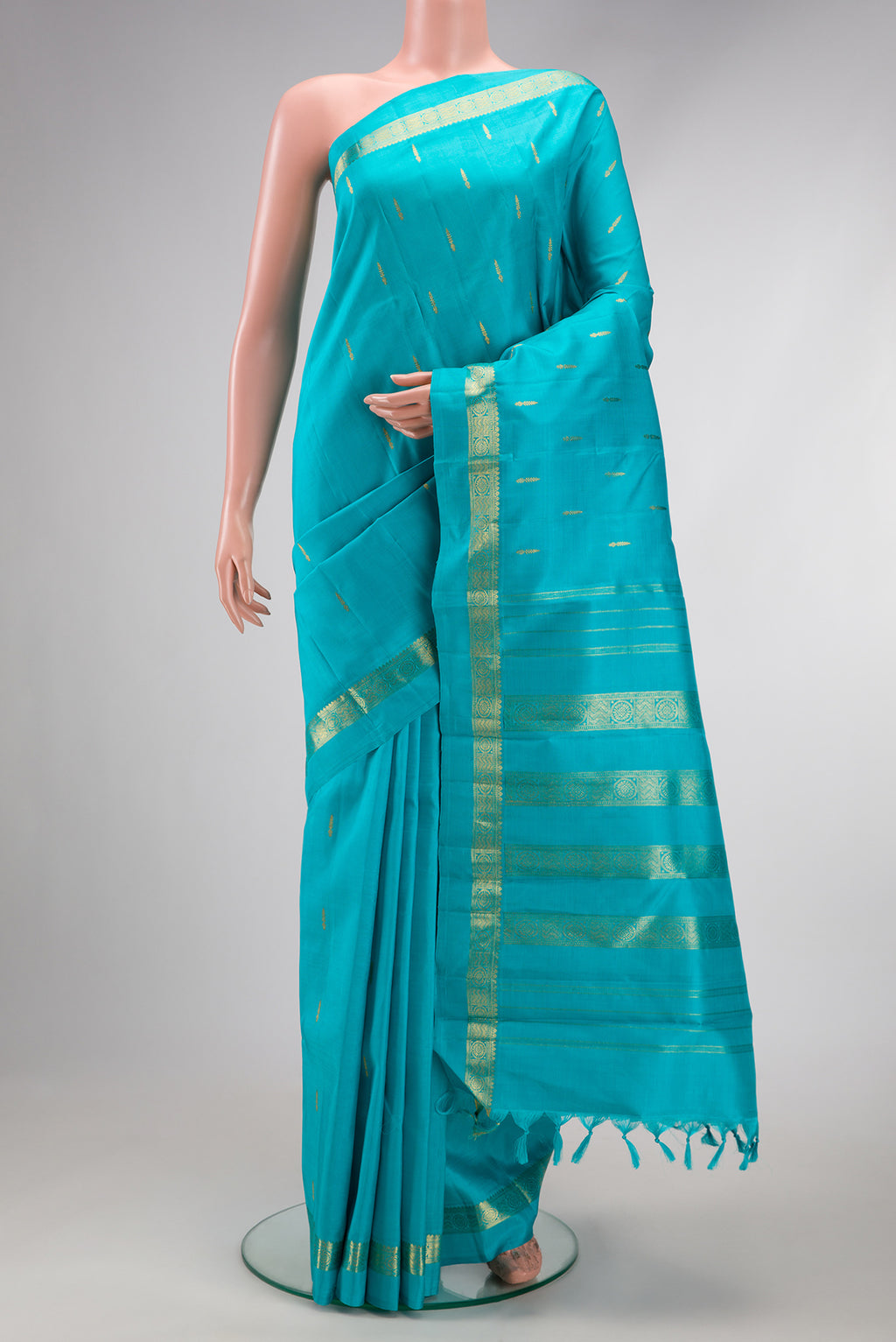 Sky Blue Dual Tone Kanchipuram Silk Saree with Zari Butta on the body and Zari Border.  displayed on a mannequin
