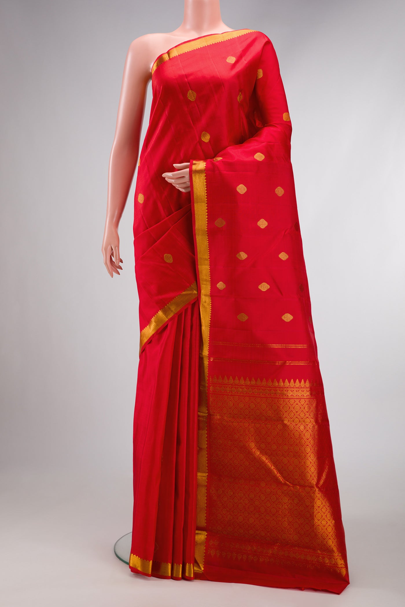 Red Dual Tone Kanchipuram Silk Saree with Zari Butta on the body and Zari Border.  displayed on a mannequin