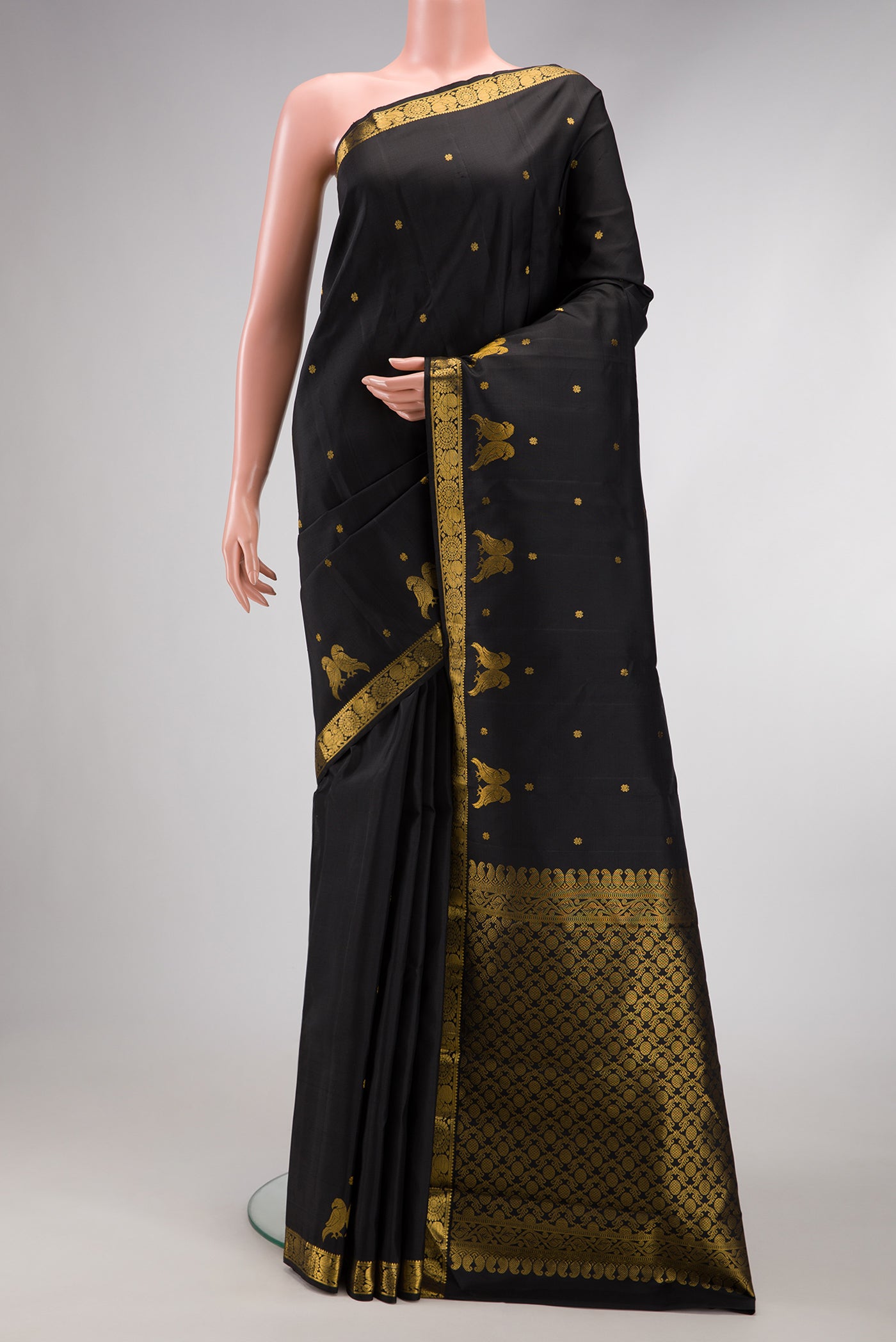 Black Dual Tone Soft Silk Saree with Zari Butta on the body and Fancy Border.  displayed on a mannequin