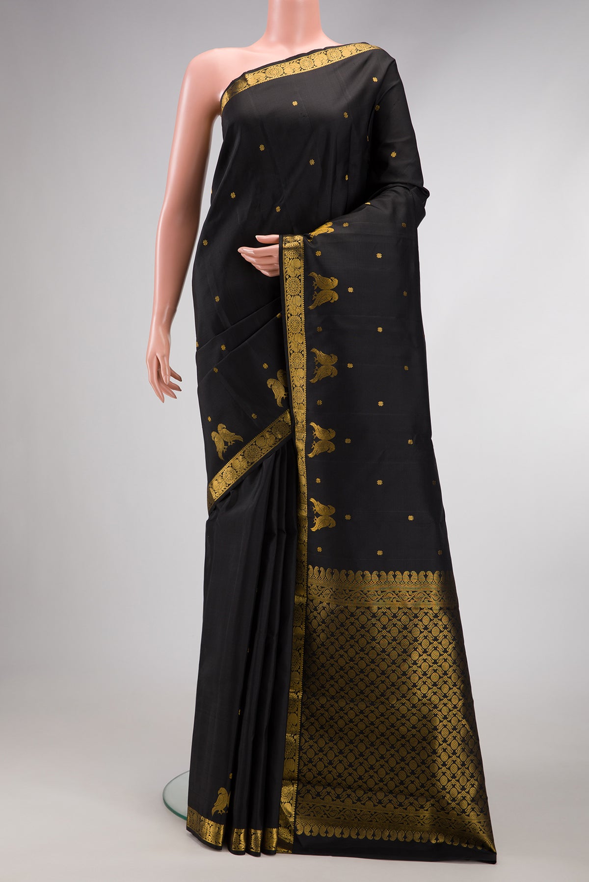 Black Dual Tone Soft Silk Saree with Zari Butta on the body and Fancy Border.  displayed on a mannequin