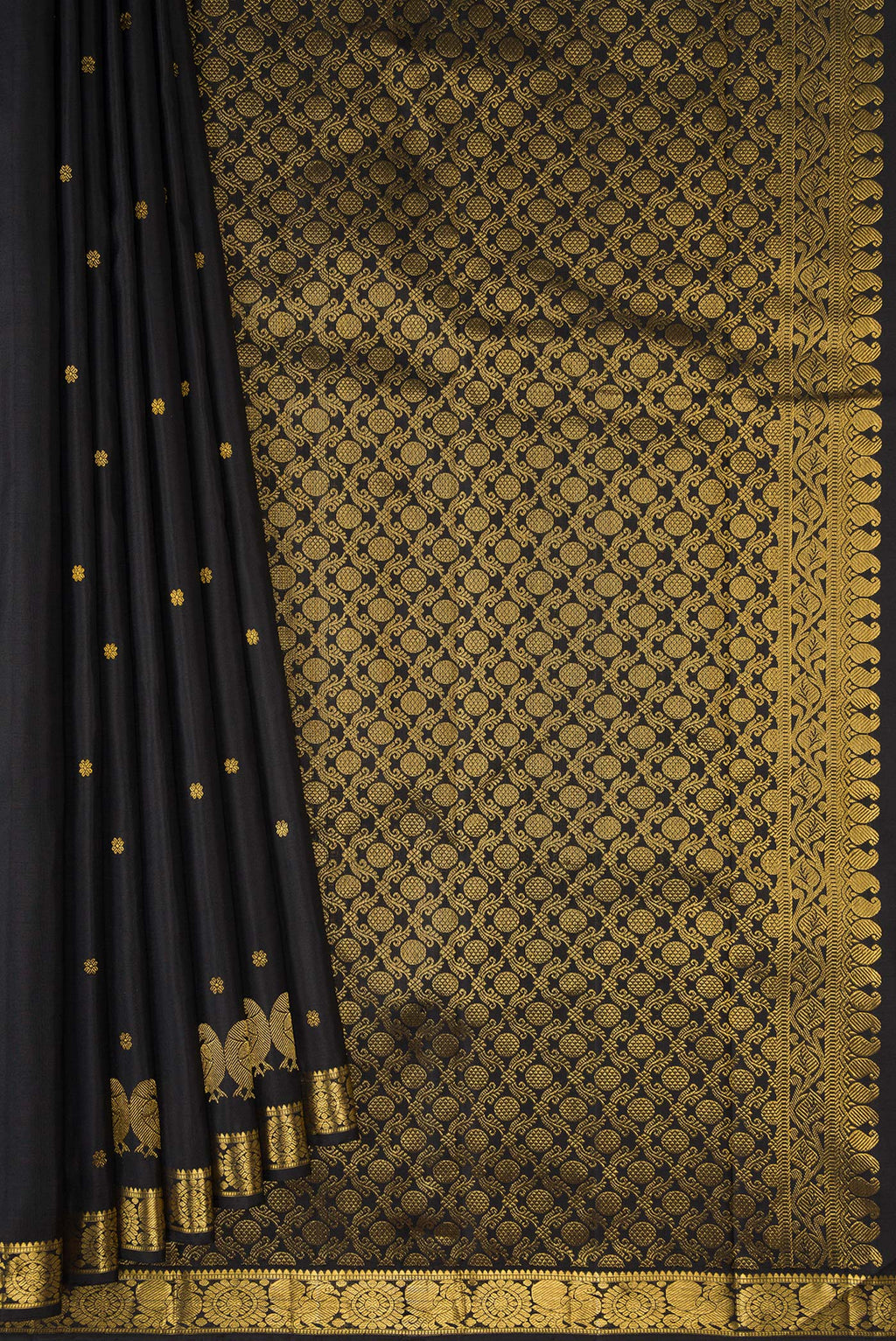 Pleats and pallu of Black Dual Tone Soft Silk Saree with Zari Butta on the body and Fancy Border. 