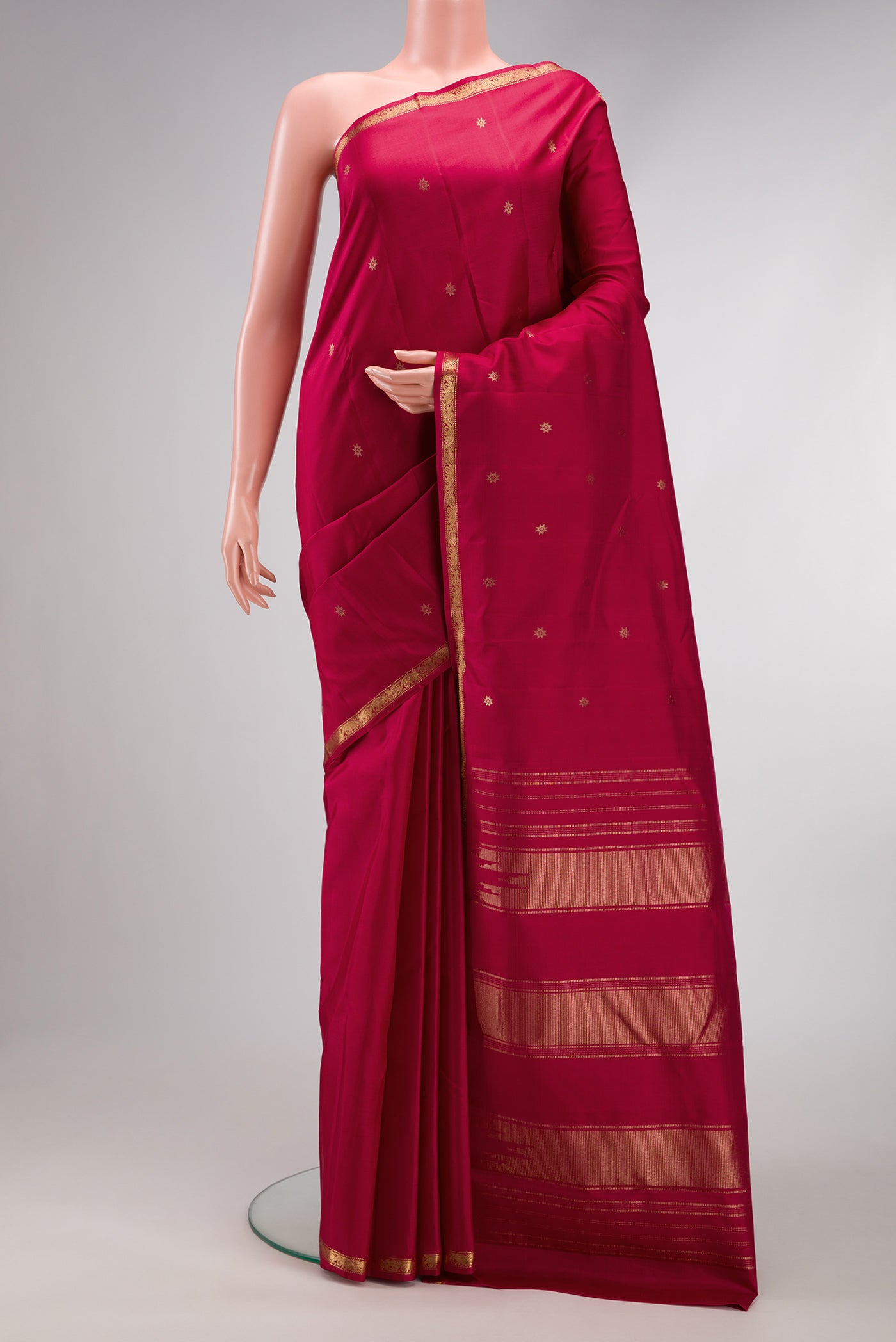 Maroon Dual Tone Kanchipuram Silk Saree with Zari Butta on the body and Zari Border.  displayed on a mannequin