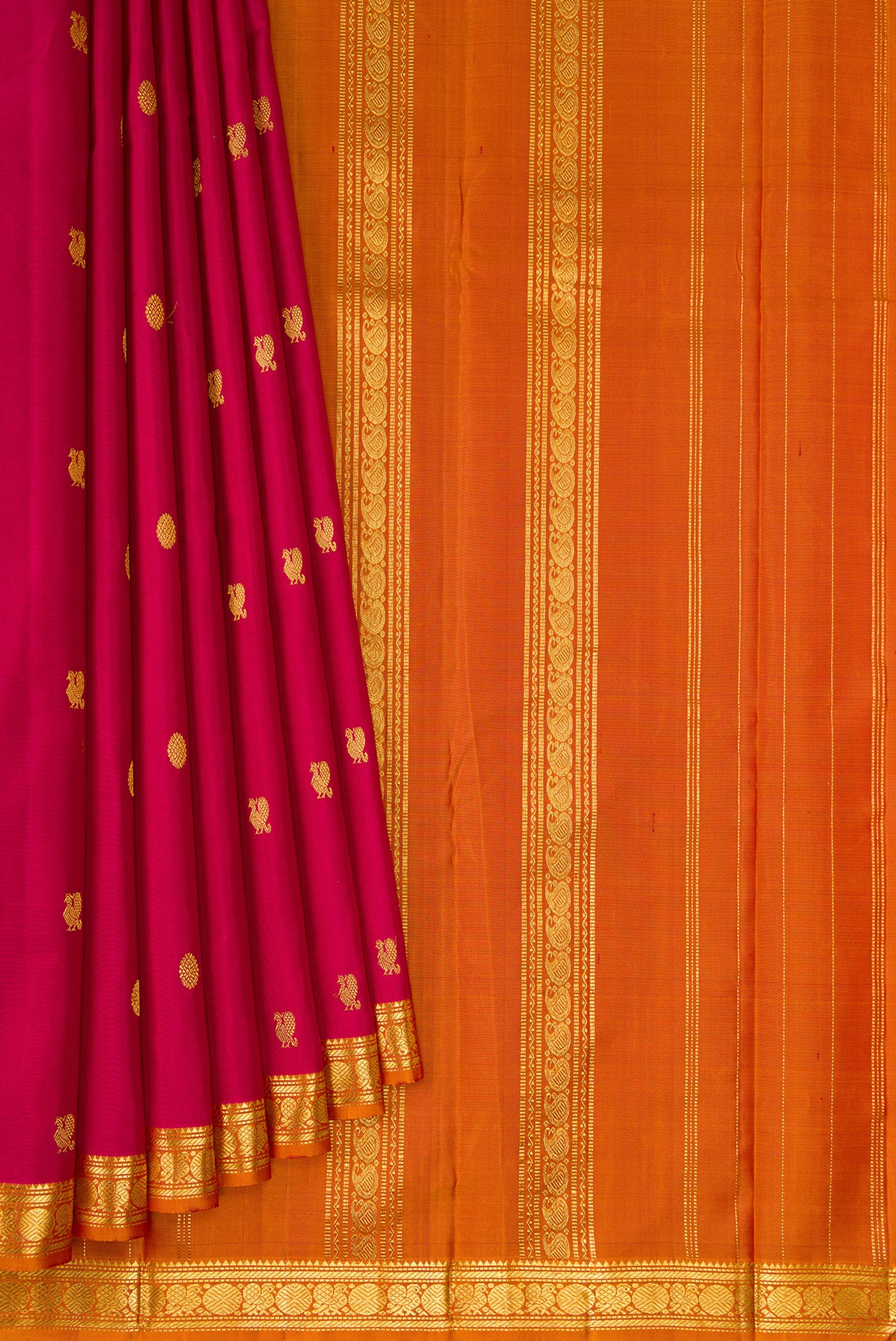 Pleats and pallu of Maroon Kanchipuram Silk Saree with Zari Butta on the body and Zari Border. 