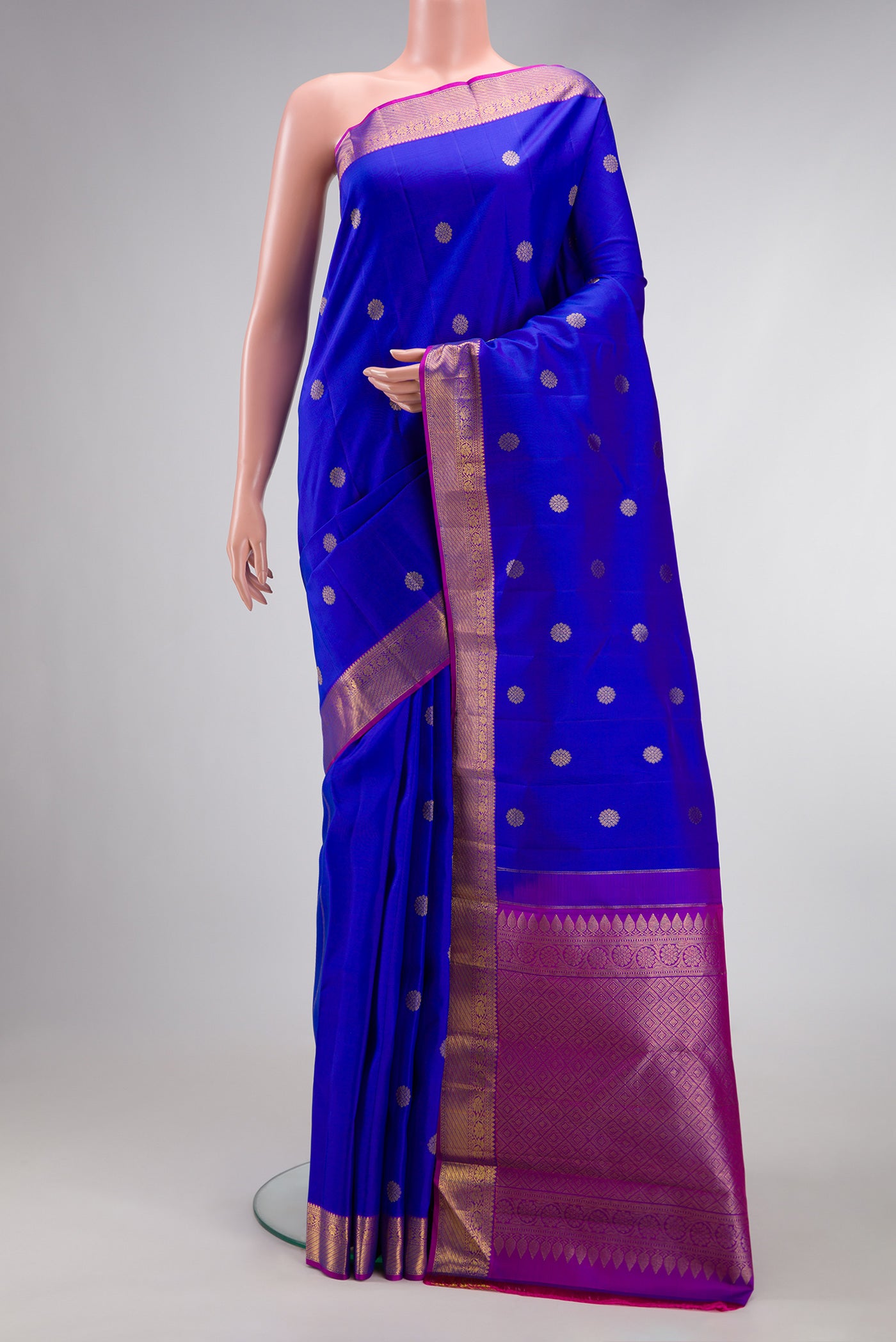Royal Blue Dual Tone Kanjivaram Silk Saree with Zari Butta on the body and Zari Border.  displayed on a mannequin