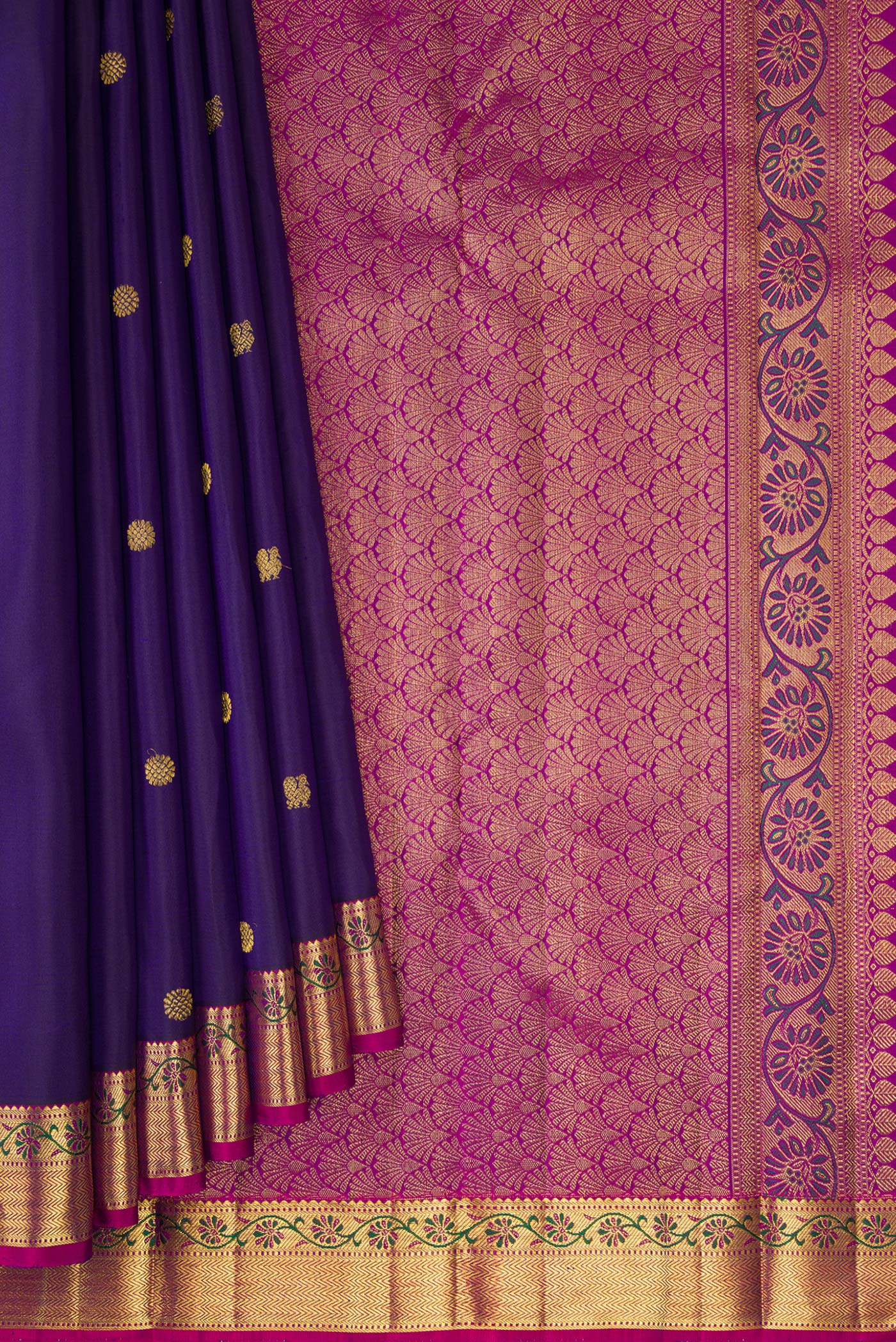 Pleats and pallu of Navy Blue Kanjivaram Silk Saree with Zari Butta on the body and Zari And Thread Border. 