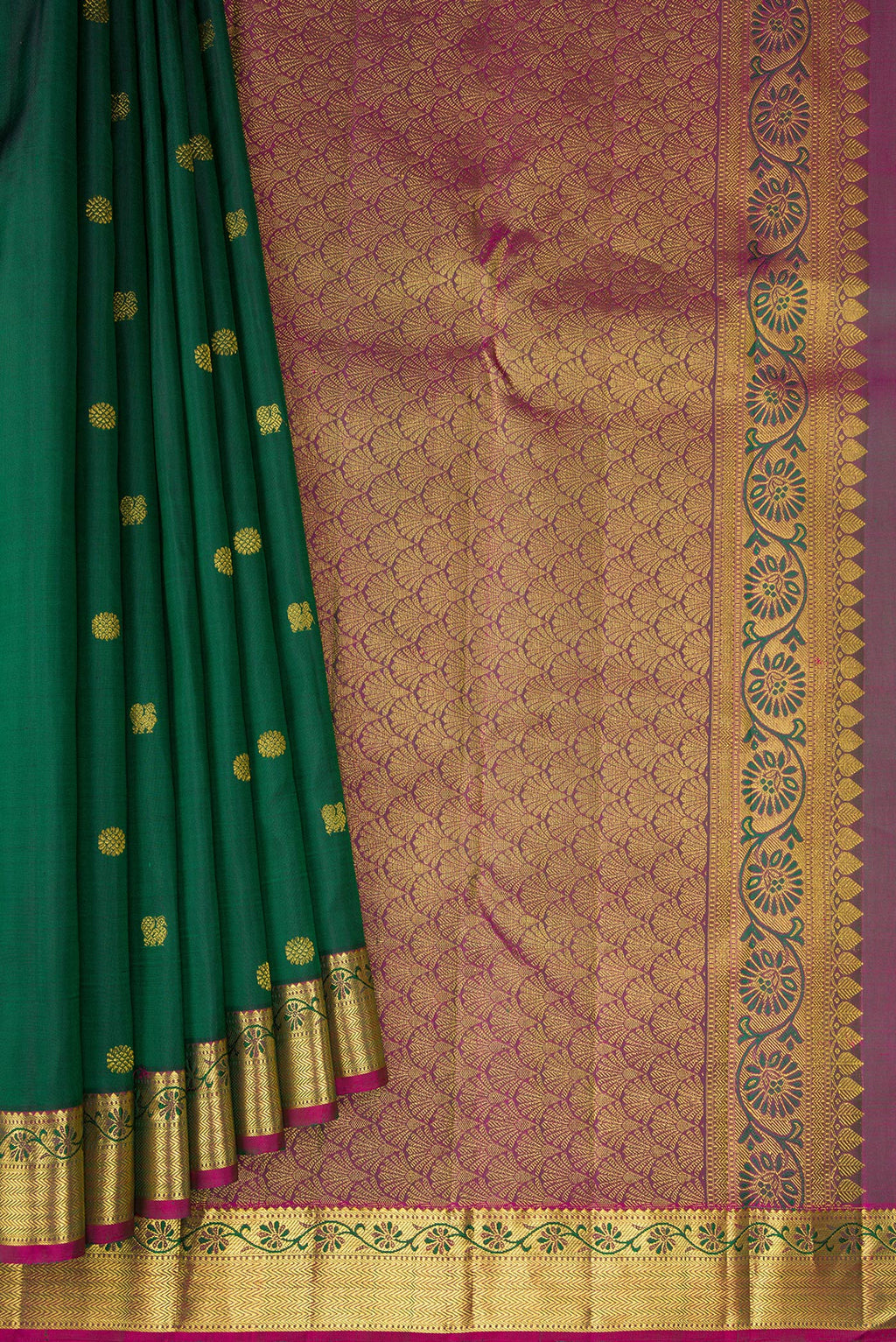 Pleats and pallu of Bottle Green Kanjivaram Silk Saree with Zari Butta on the body and Zari Border. 
