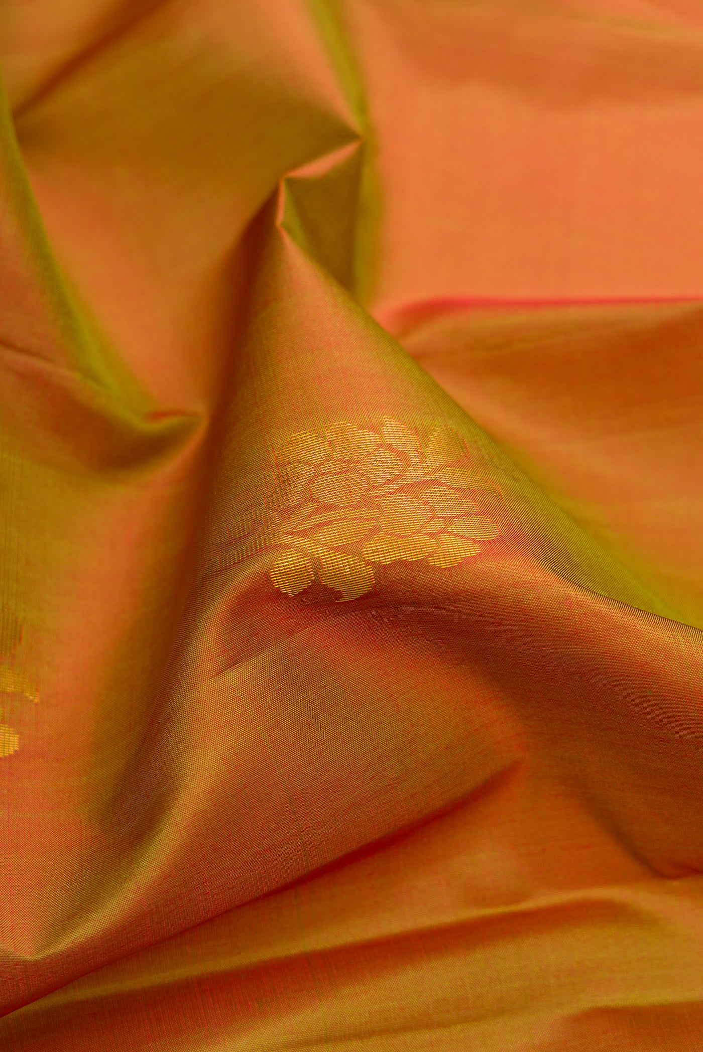 Close up of Mehandi Green Dual Tone Soft Silk Saree with Zari Butta on the body and Fancy Border.  displaying folds