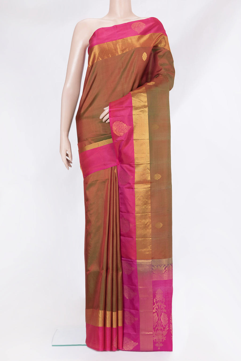 Mehandi Green Dual Tone Soft Silk Saree with Zari Butta on the body and Fancy Border.  displayed on a mannequin