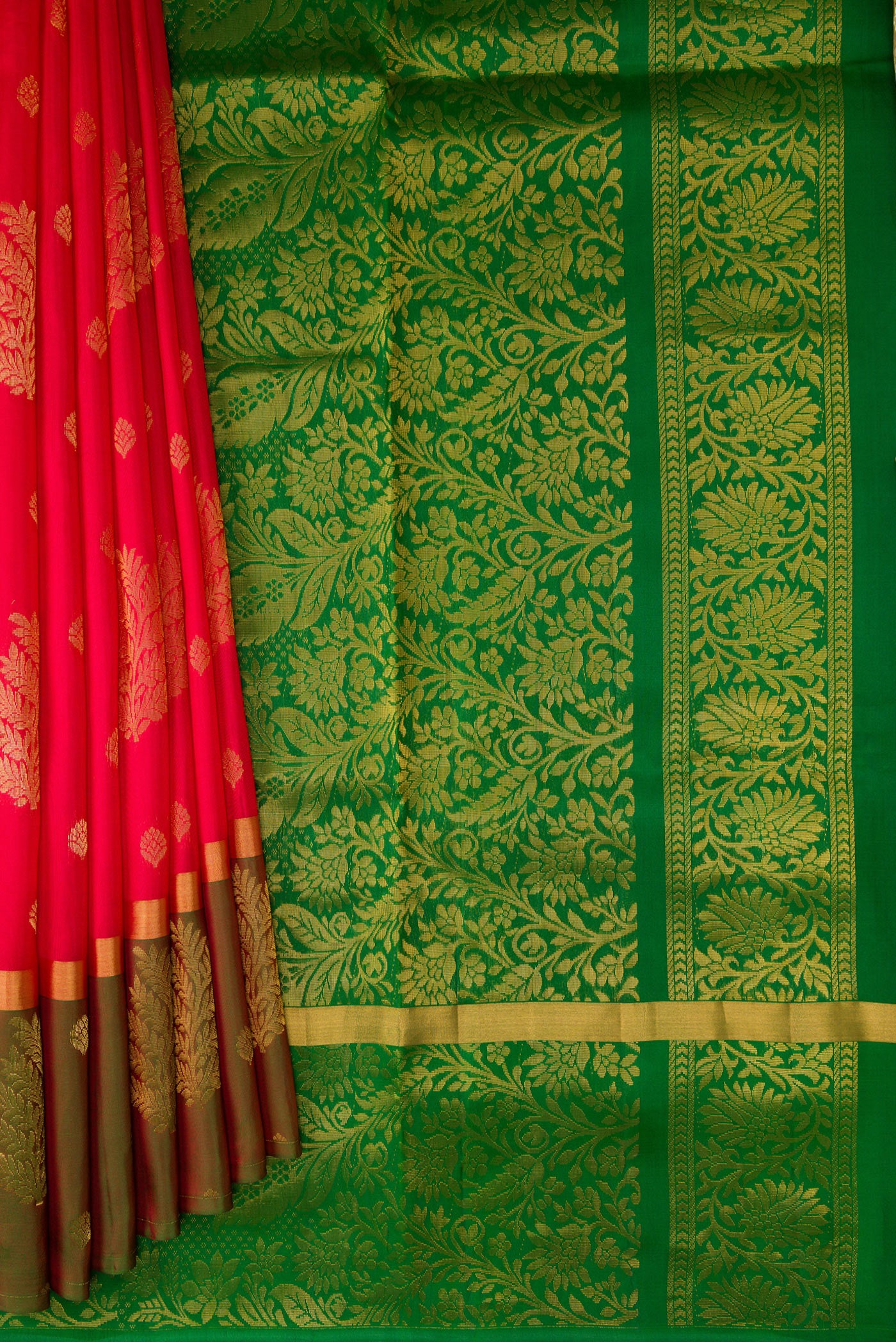 Pleats and pallu of Pink Soft Silk Saree with Zari Butta on the body and Fancy Border. 