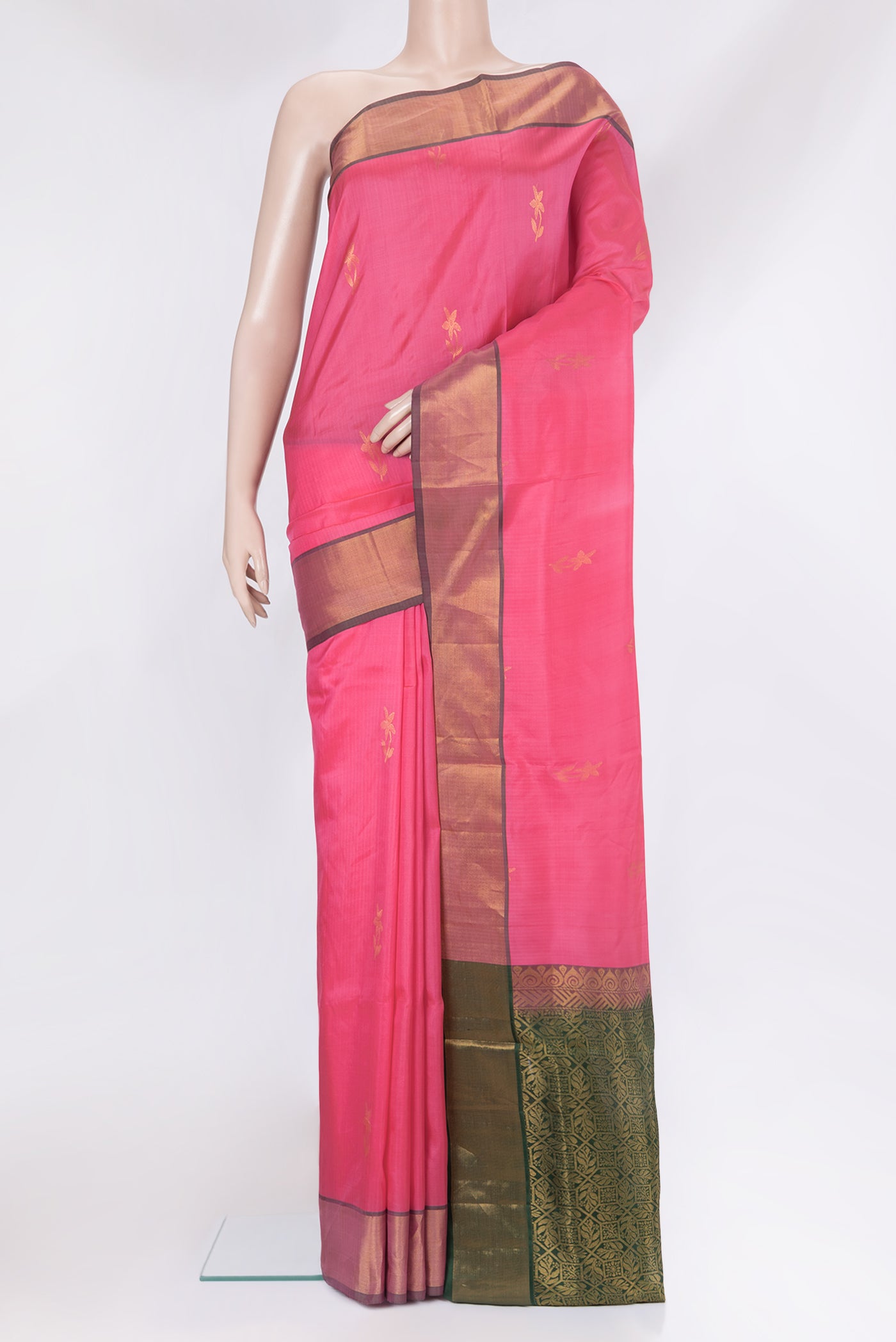 Pink Soft Silk Saree with Zari Butta on the body and Plain Border.  displayed on a mannequin