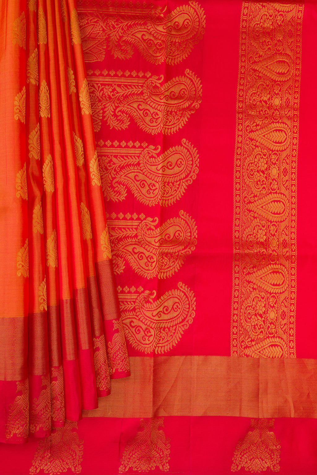 Pleats and pallu of Orange Dual Tone Soft Silk Saree with Zari Butta on the body and Fancy Border. 
