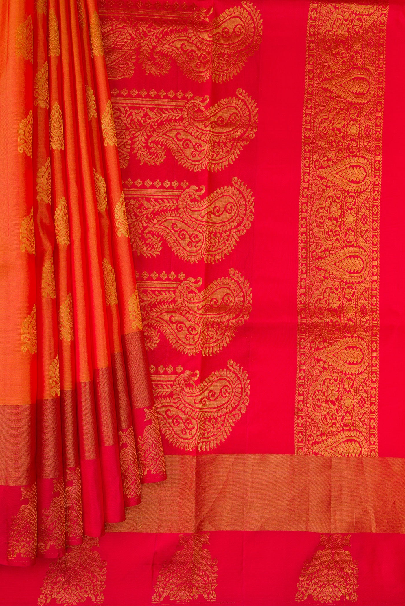 Pleats and pallu of Orange Dual Tone Soft Silk Saree with Zari Butta on the body and Fancy Border. 